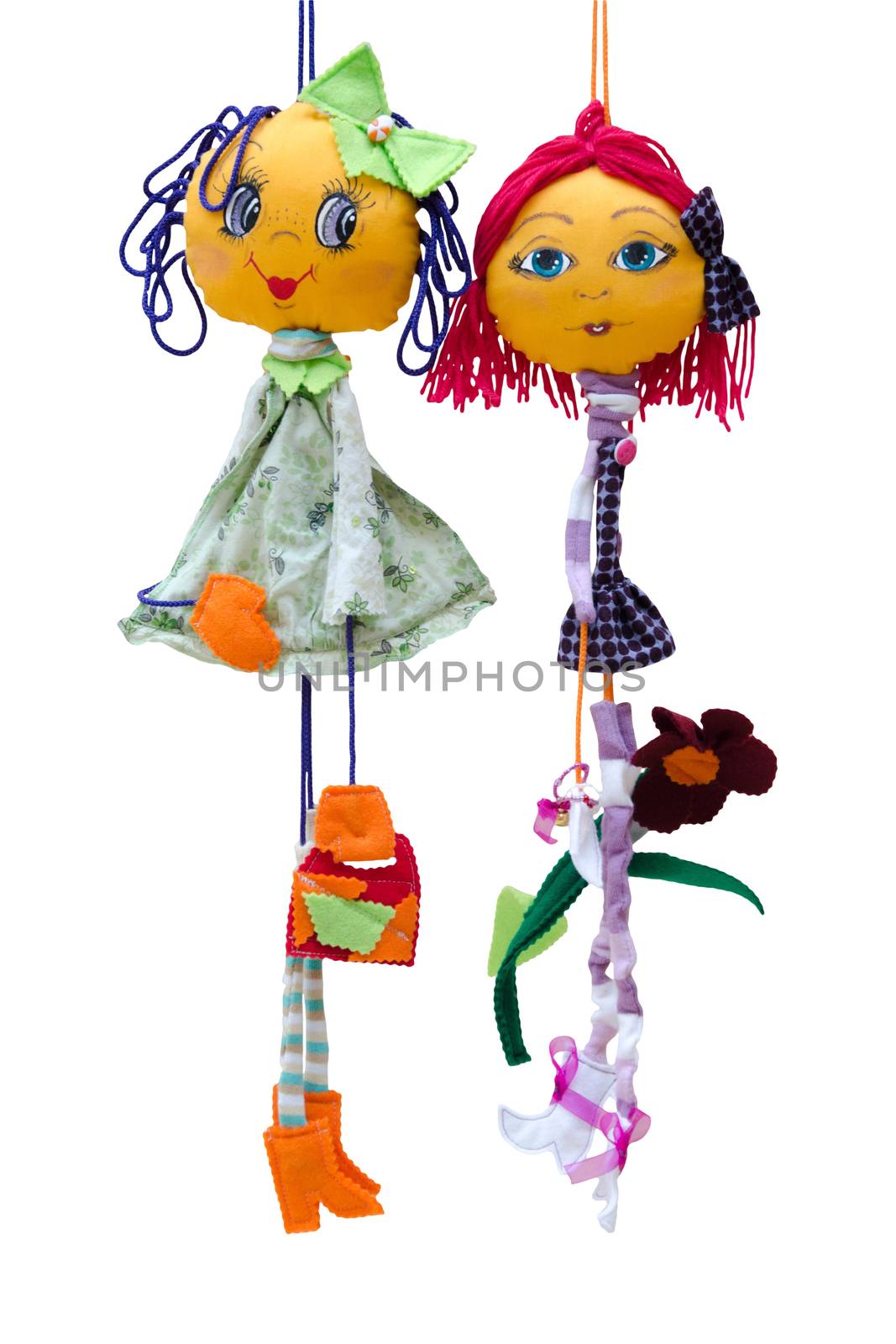 The Handmade dolls toys isolated thin cheerful girls in short fashionable dresses