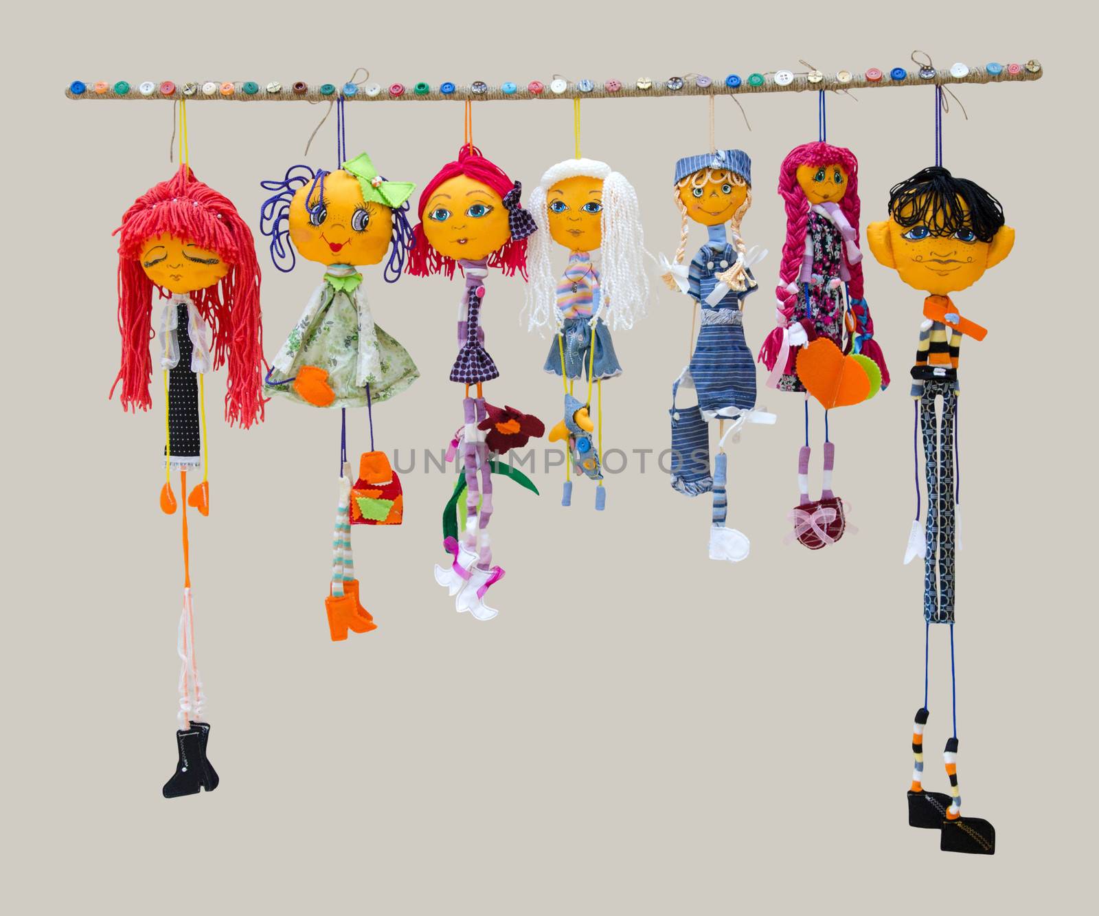 The Six female and one male handmade isolated thin dolls toys in fashionable dresses