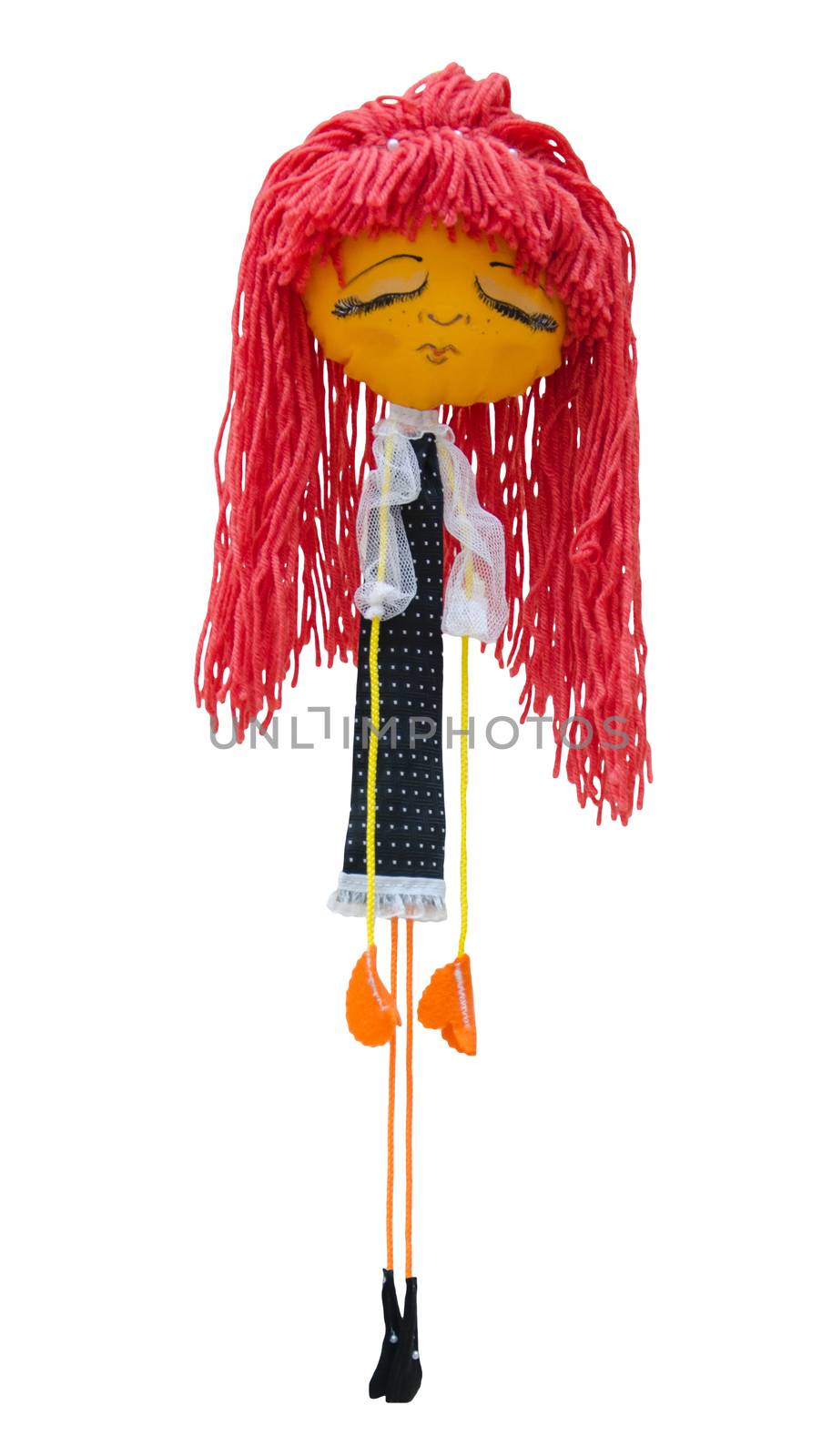 The handmade doll toy isolated thin embarrassed sad girl in a dress with mesh sleeves