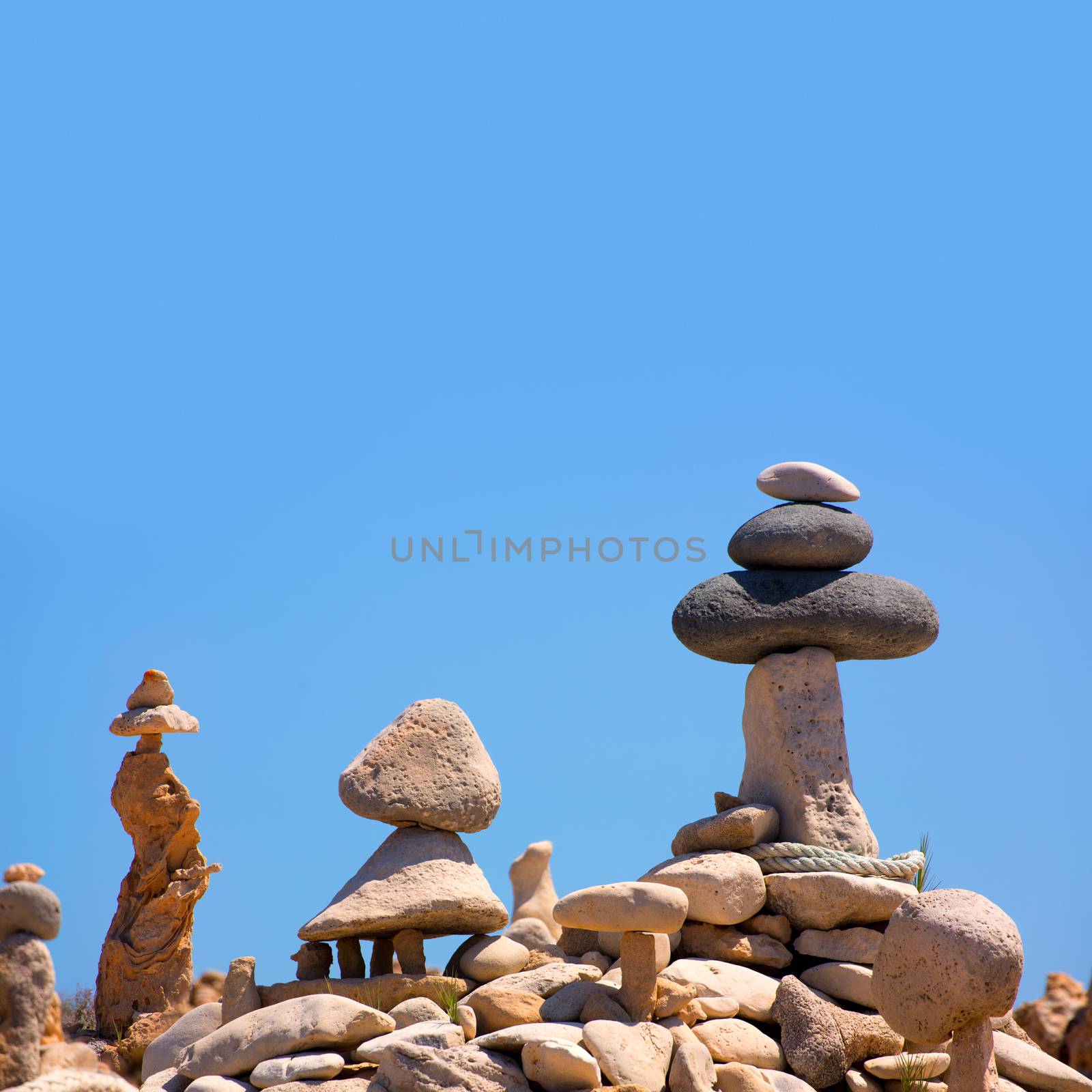 Stone figures on beach shore of Illetes beach in Formentera Mediterranean Balearic Islands