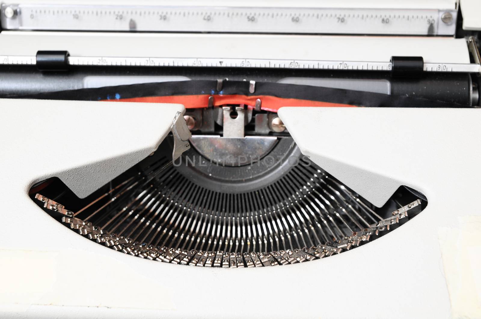 An Old Travel Vintage Typewriter on a Black Background