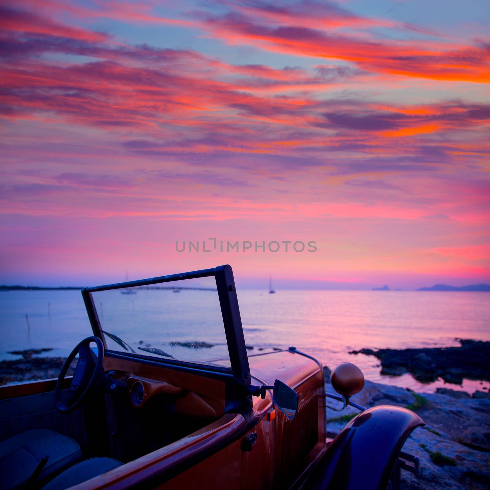 Ibiza sunset view from vintage car at formentera Island in Balearic Islands