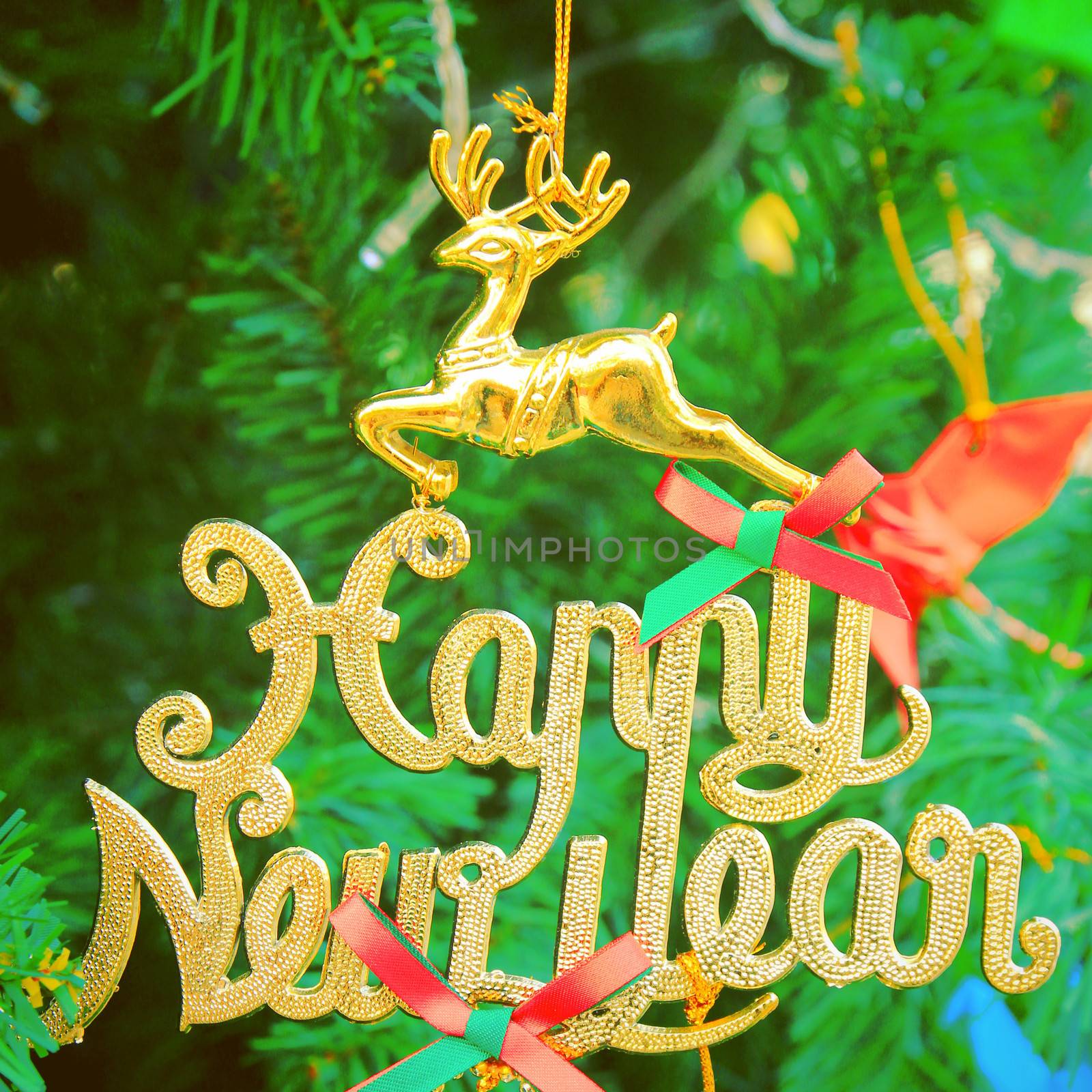 Christmas tree with happy new year decorations, retro filter eff by nuchylee