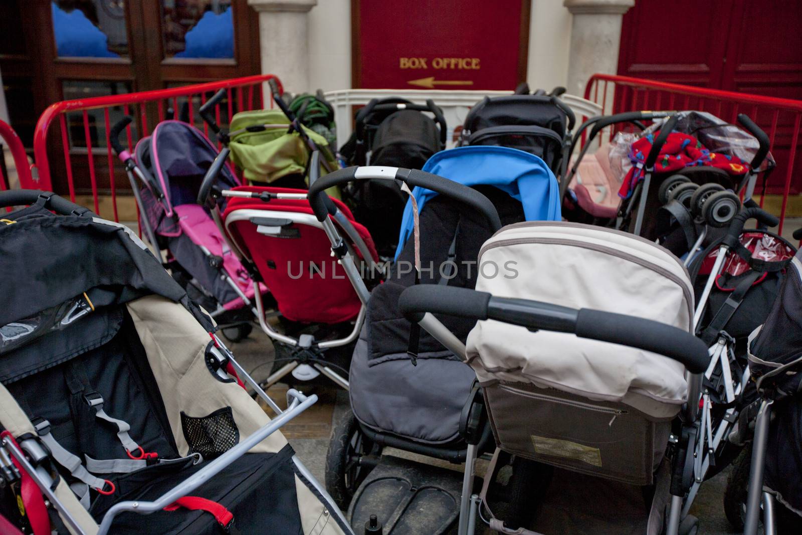 Group of prams outside theatre by moodboard