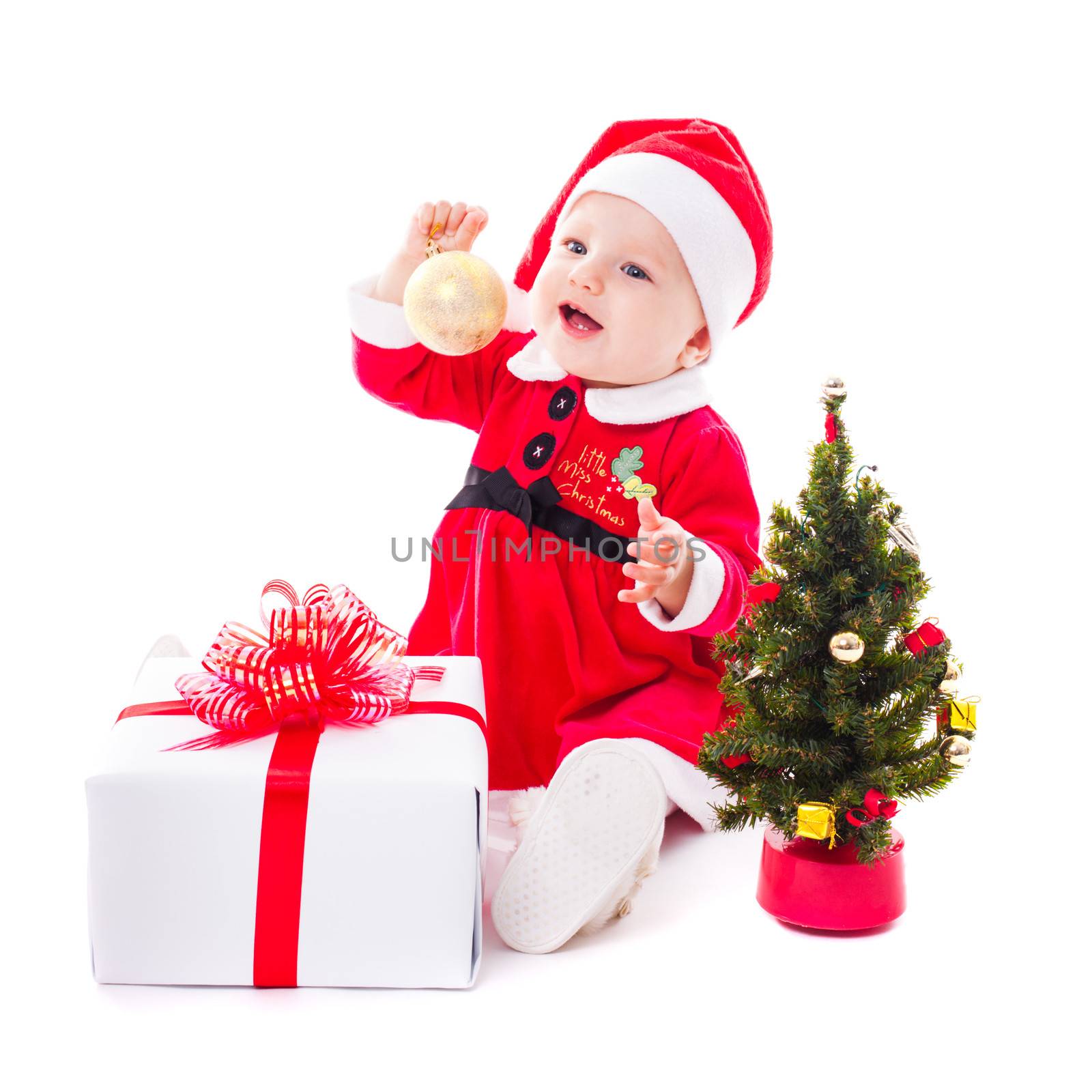 Santa baby girl with gold ball and christmas decorations on white