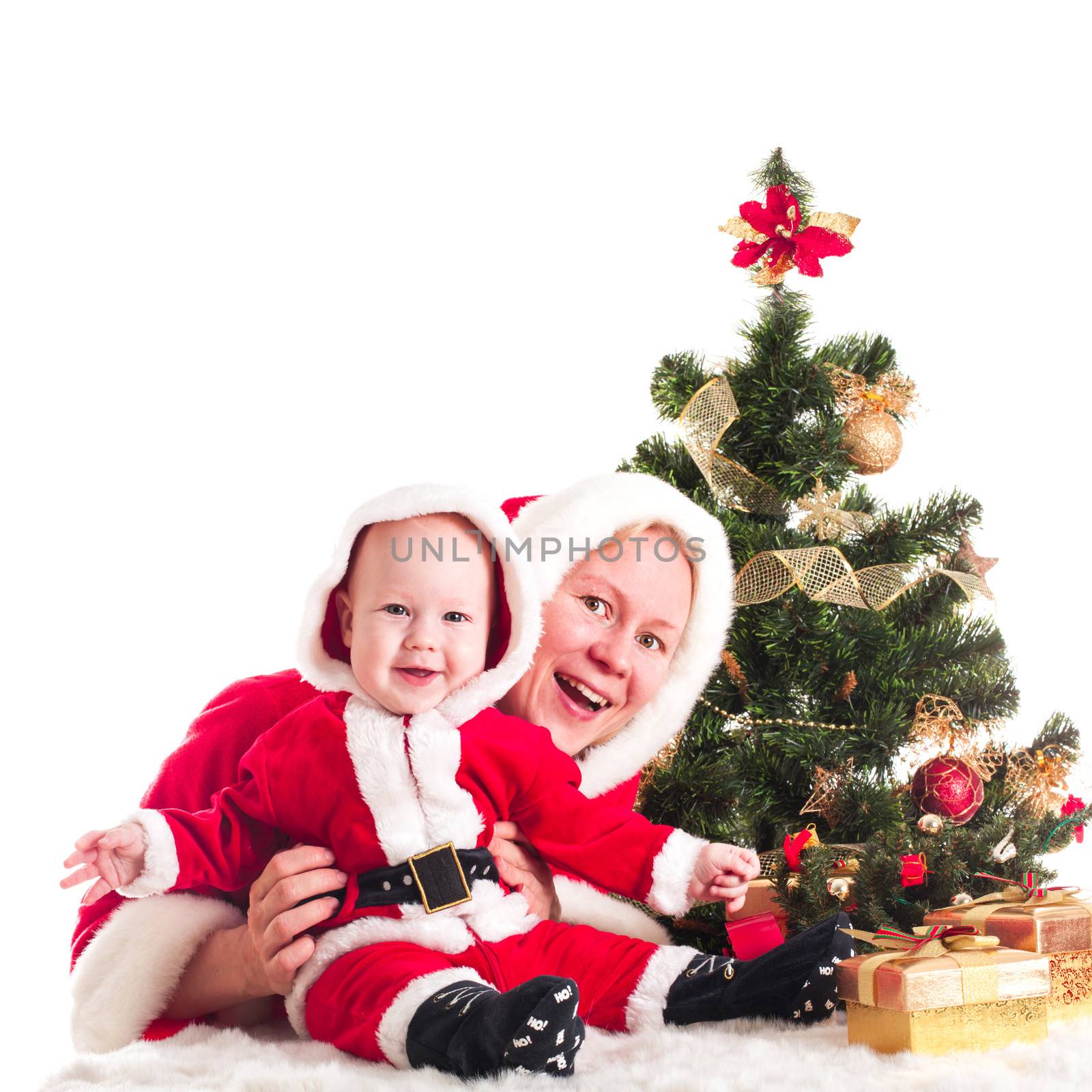 Christmas baby and mom under the fir tree isolated