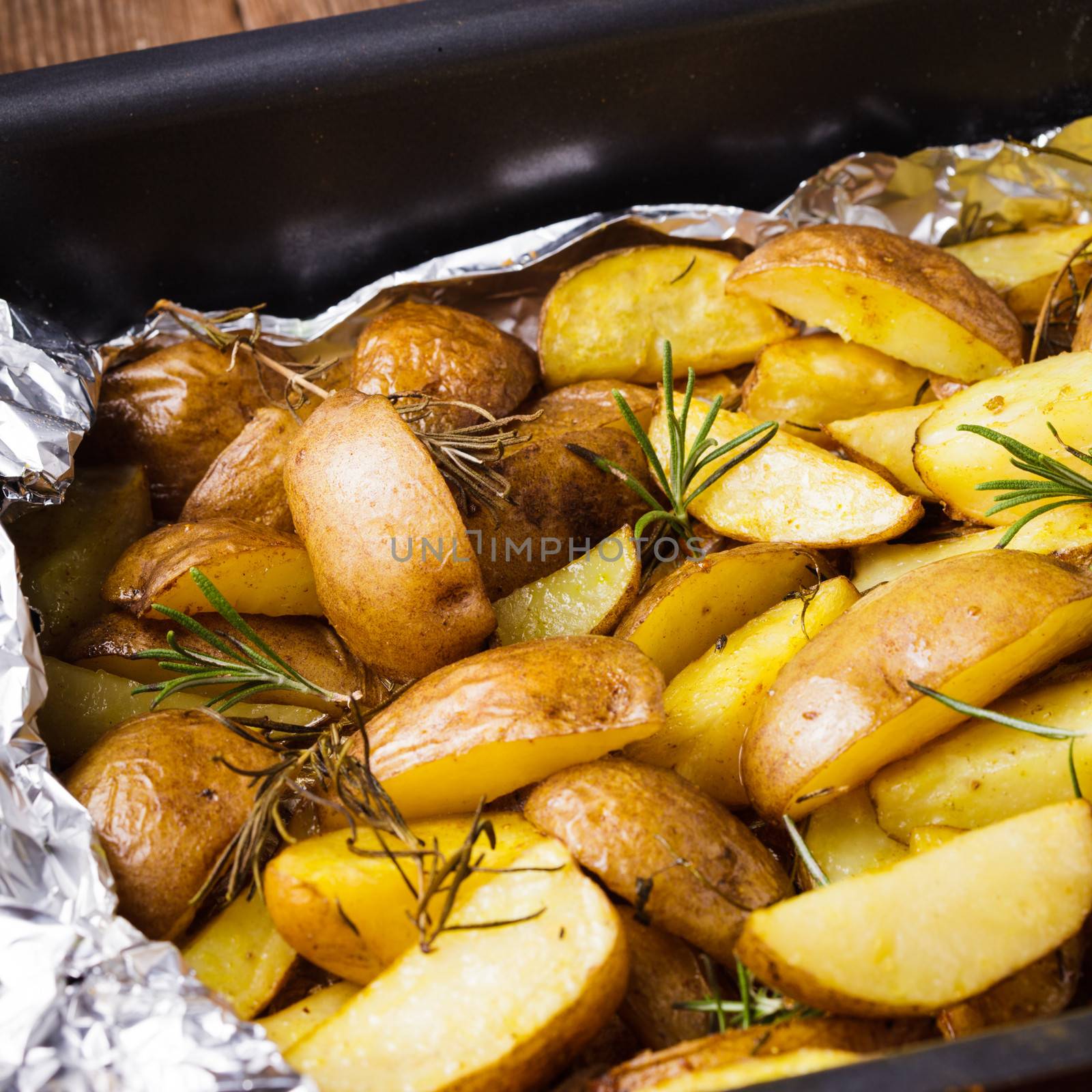 Rusic style potato  with rosemary baked in foil