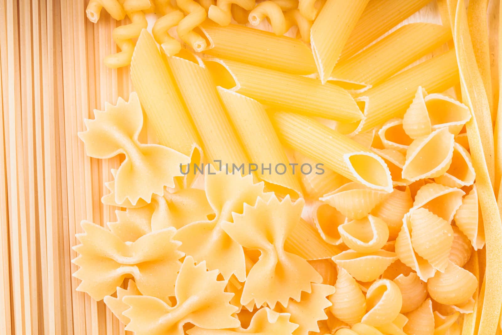 Various pasta  types as a background on the table