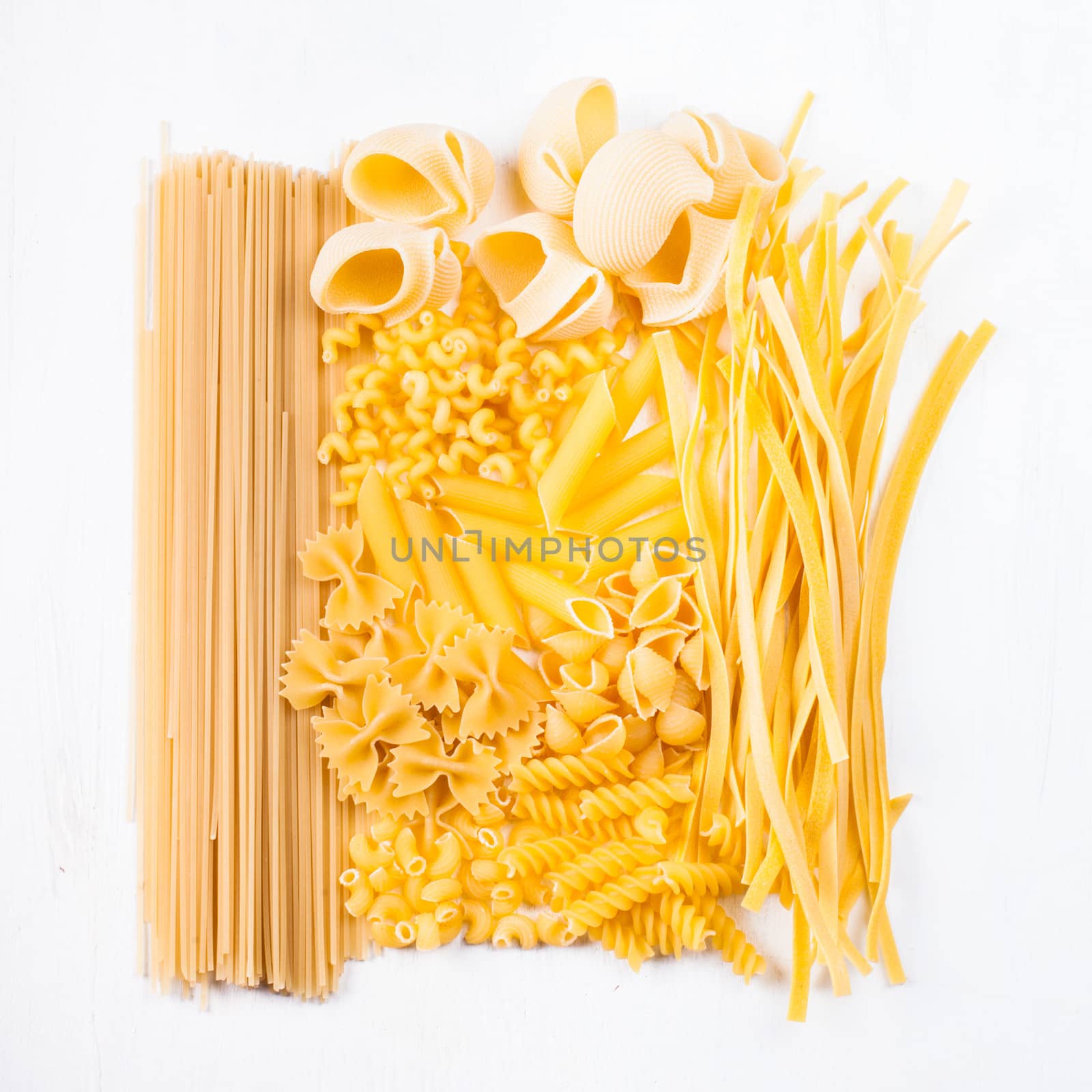 Various pasta  types as a background on the table