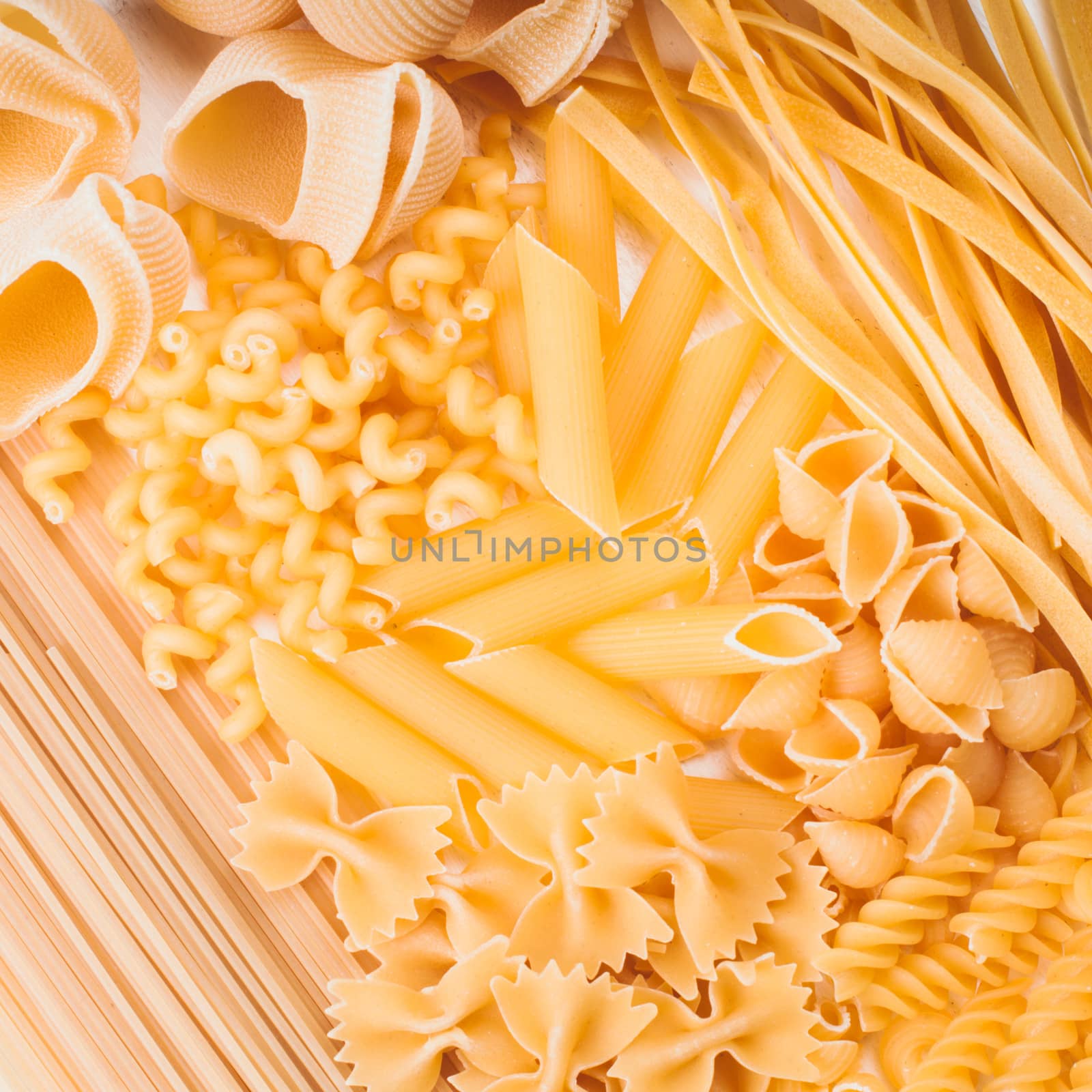 Various pasta  types as a background on the table