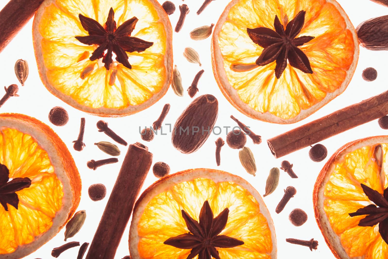 Christmas background with spices and dry orange's slices