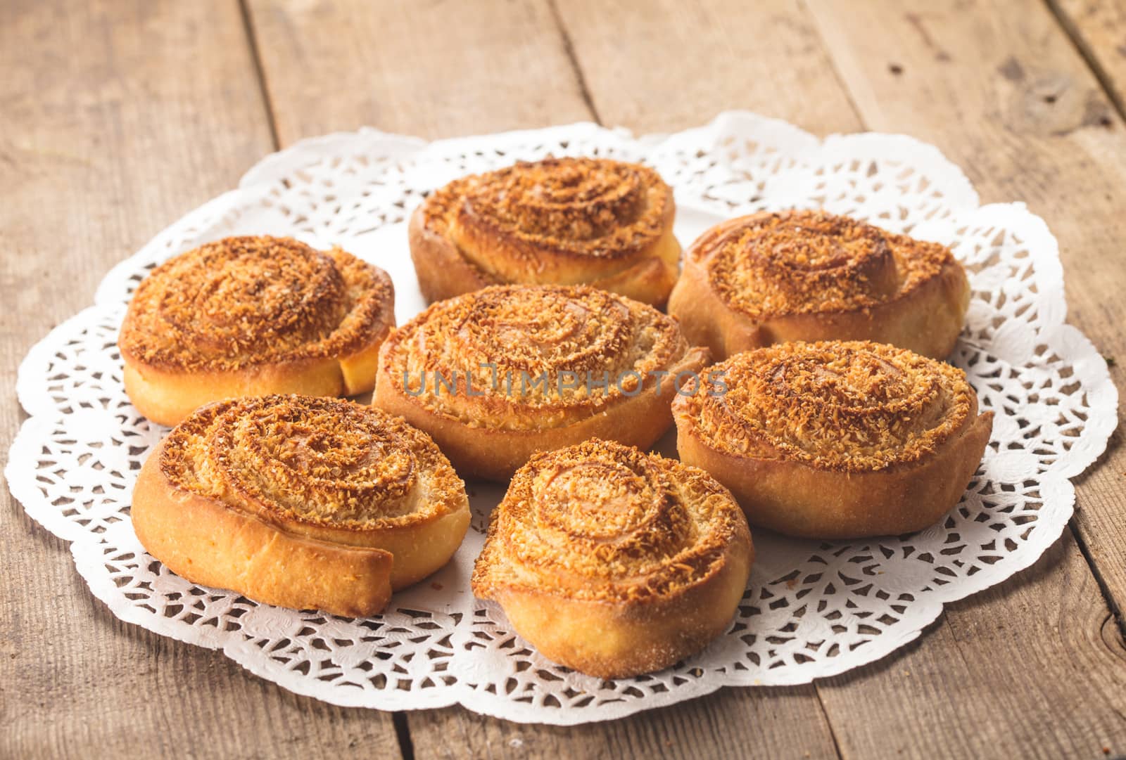 Coconut rolled buns on the wooden table