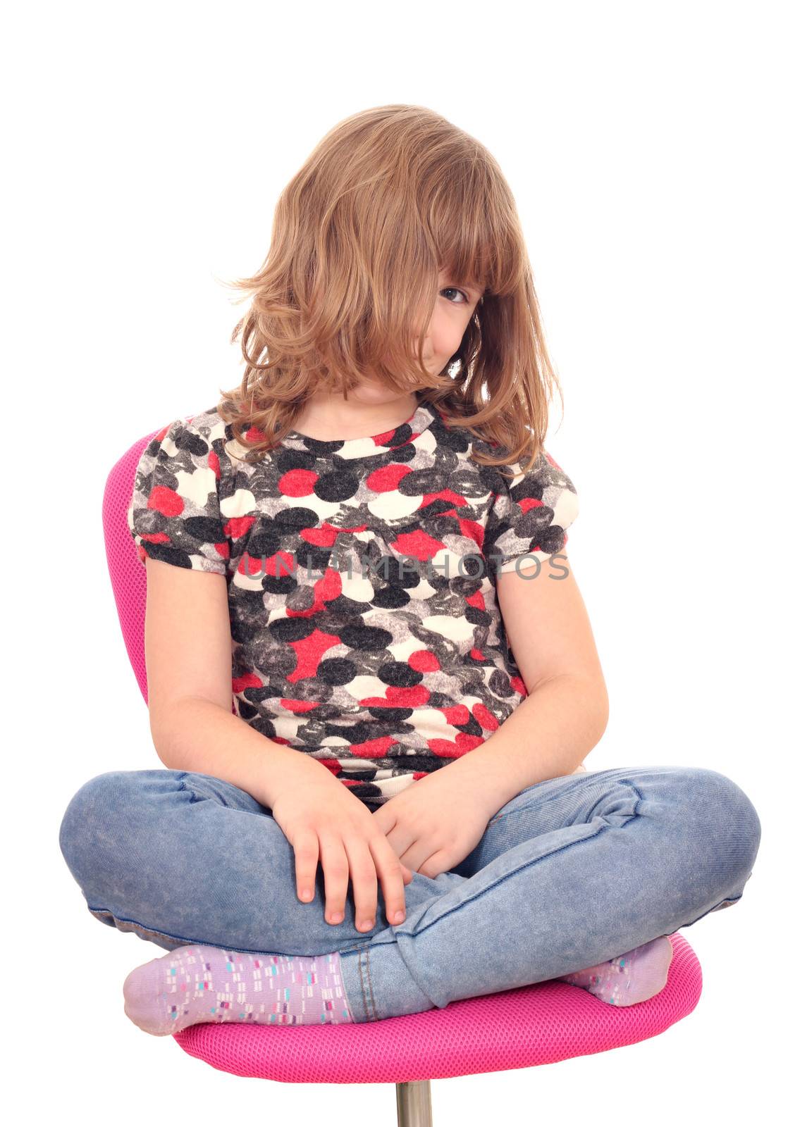 beautiful little girl sitting on chair by goce