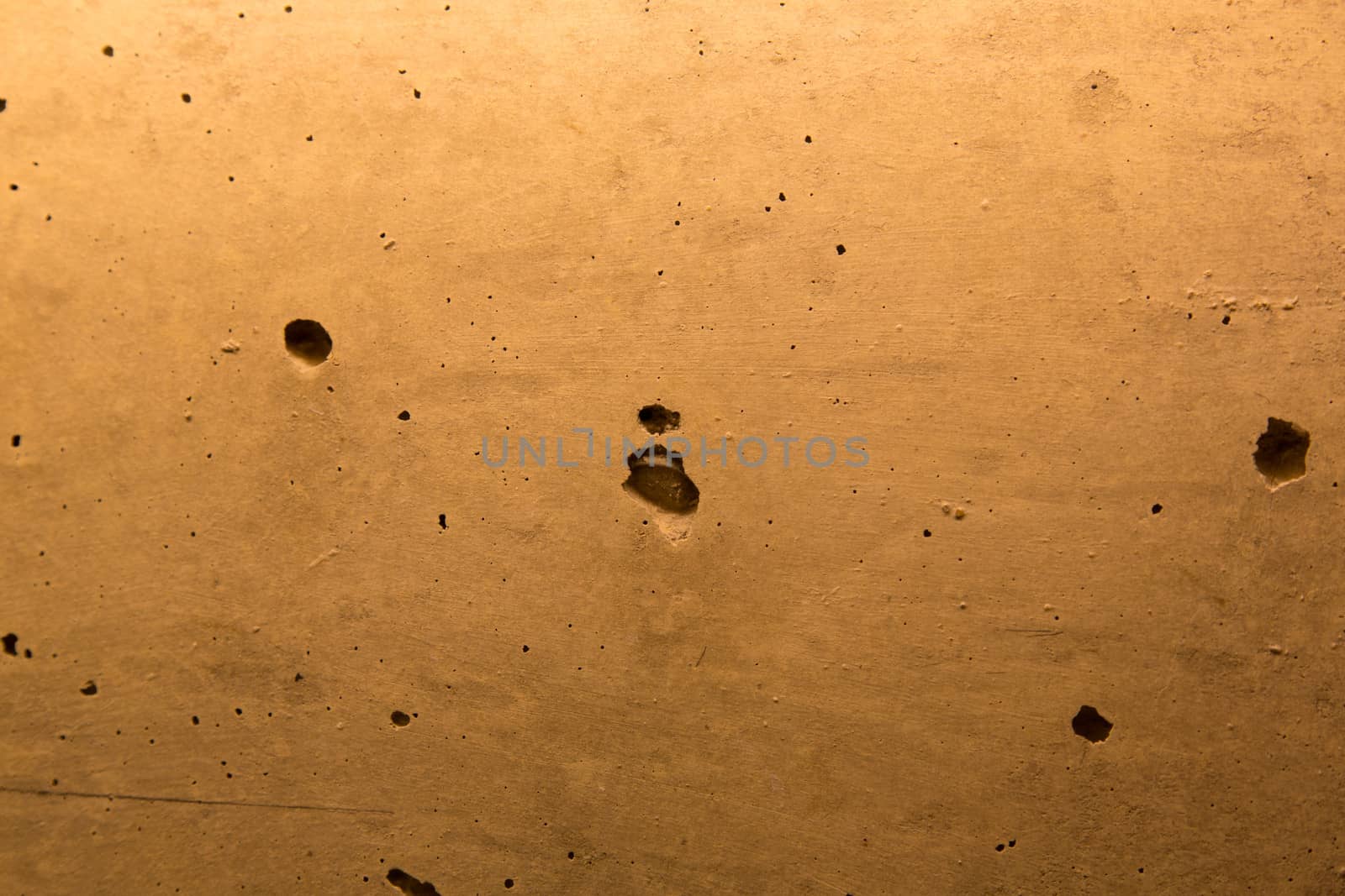 Texture of the old wall with holes by stockyimages