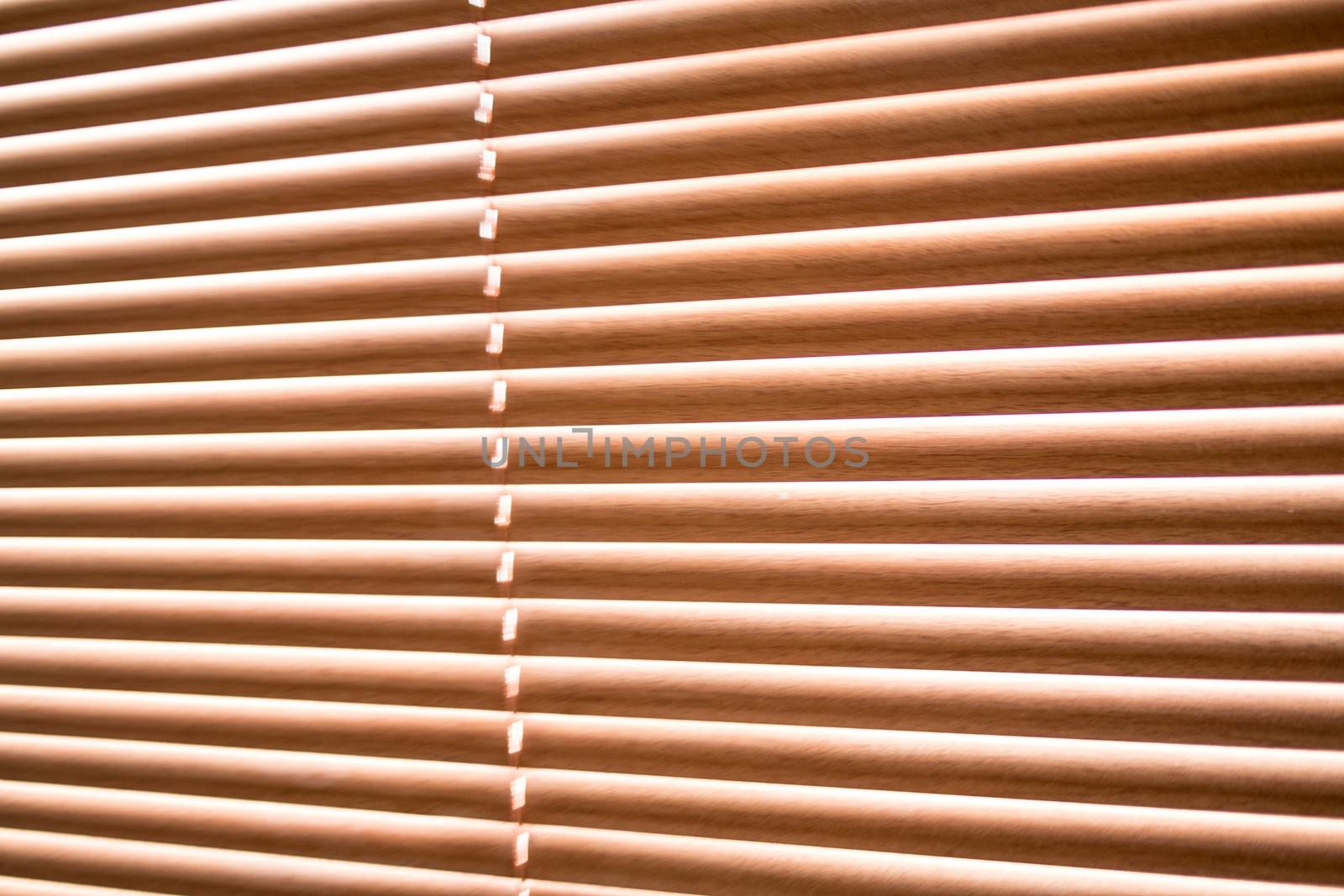 Jalousie wood blinds by stockyimages