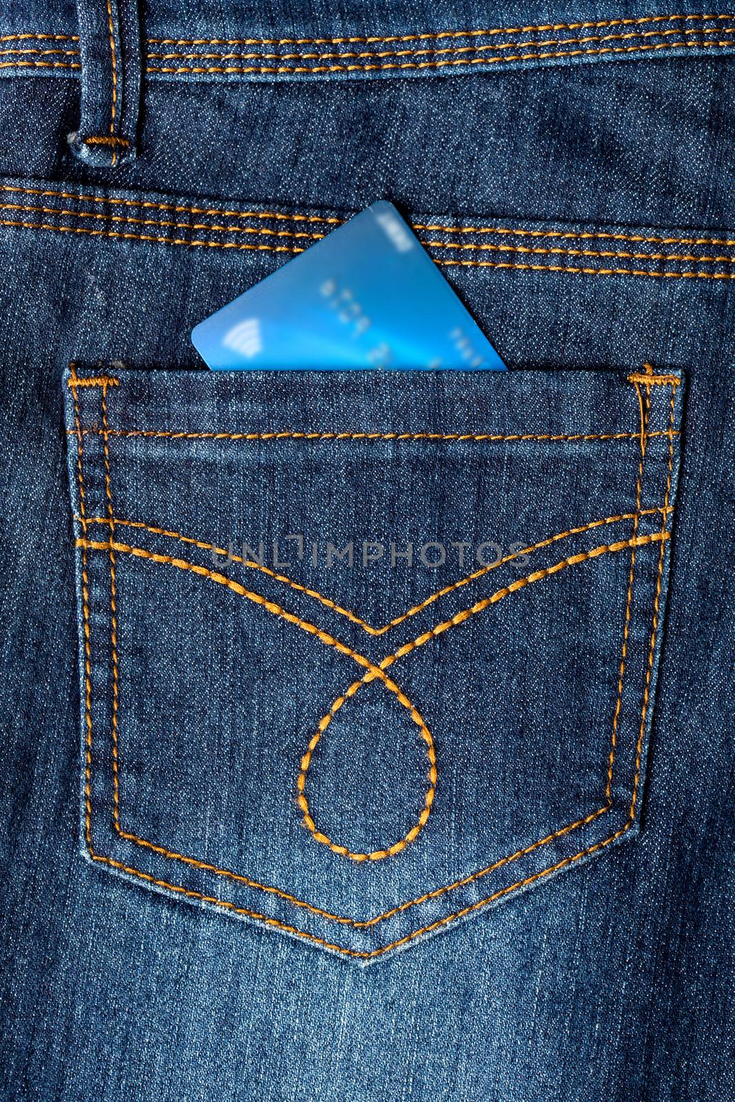 Cash card in jeans back pocket by stockyimages