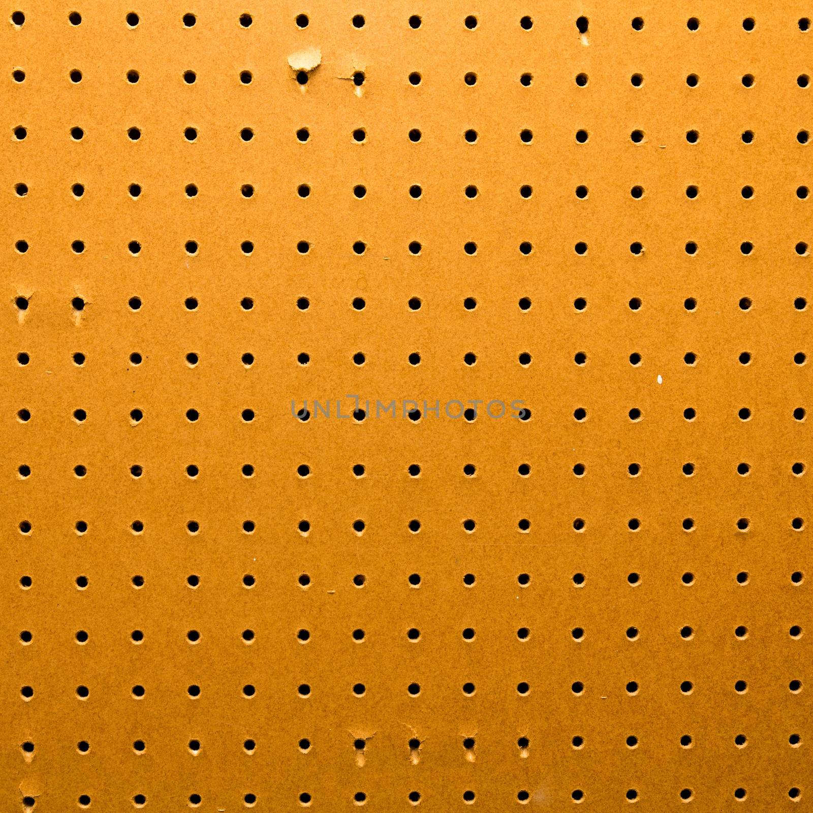 Peg board texture closeup by stockyimages