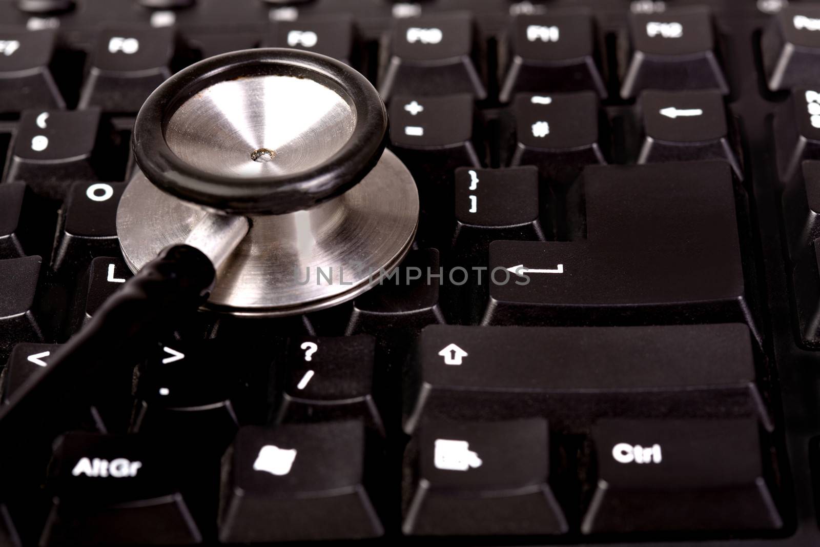 Stethoscope and computer keyboard by stockyimages