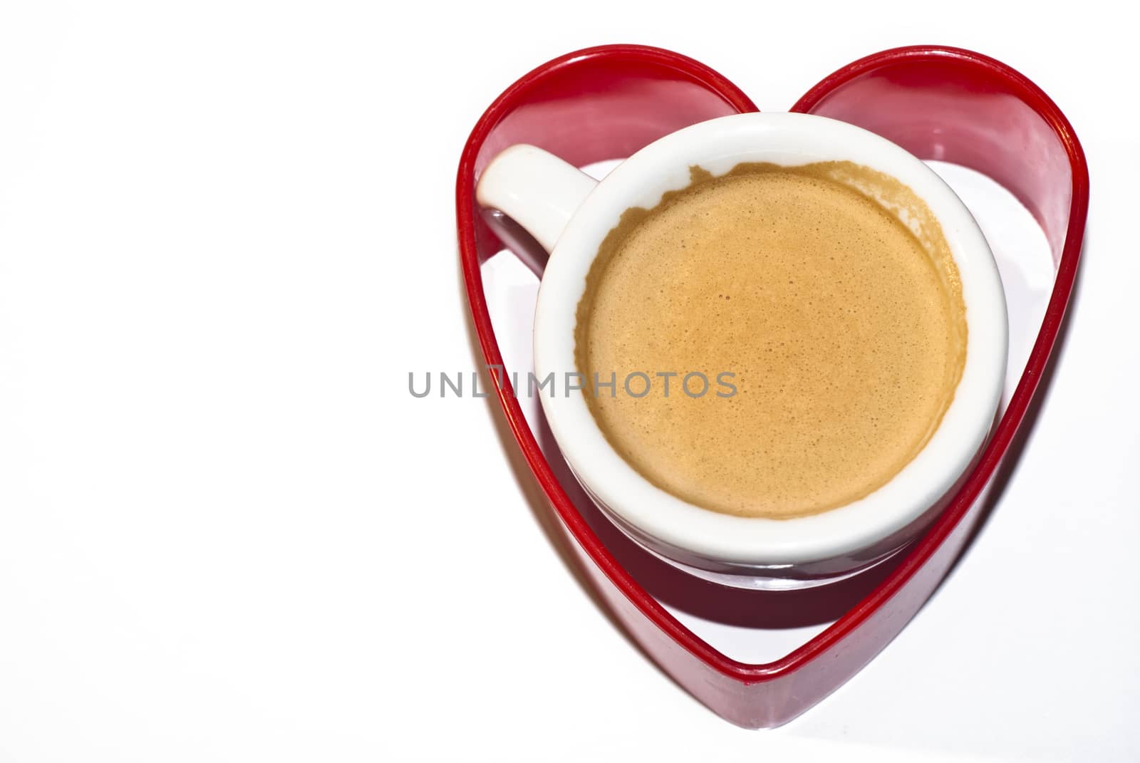 cup of coffee inside red heart shape