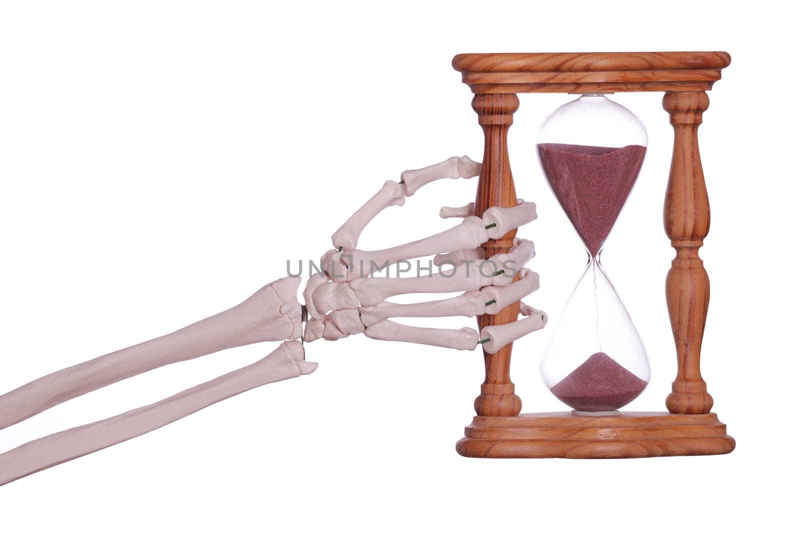 skeleton hand holding sand timer