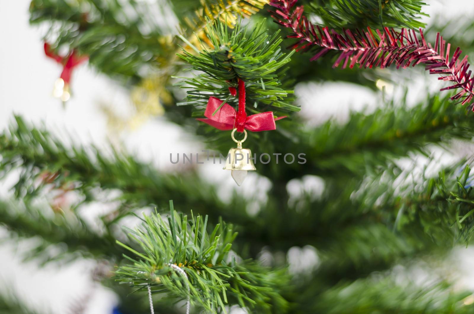 small bell on christmas tree isolated on white background