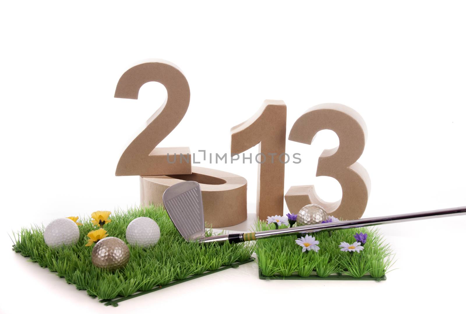 Golfstick and green symbolizes golfsport in the New year