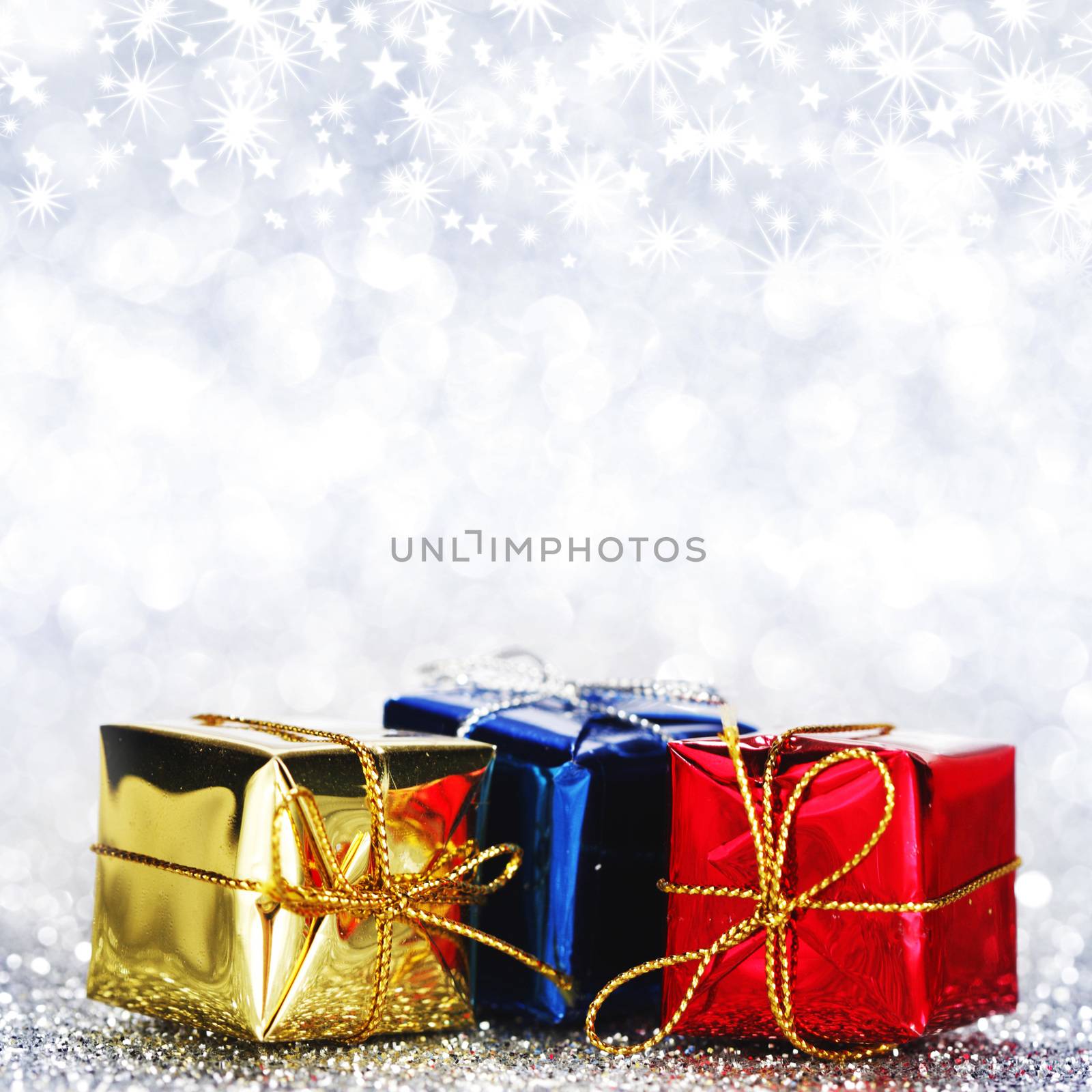 Christmas gift boxes on shiny background close-up