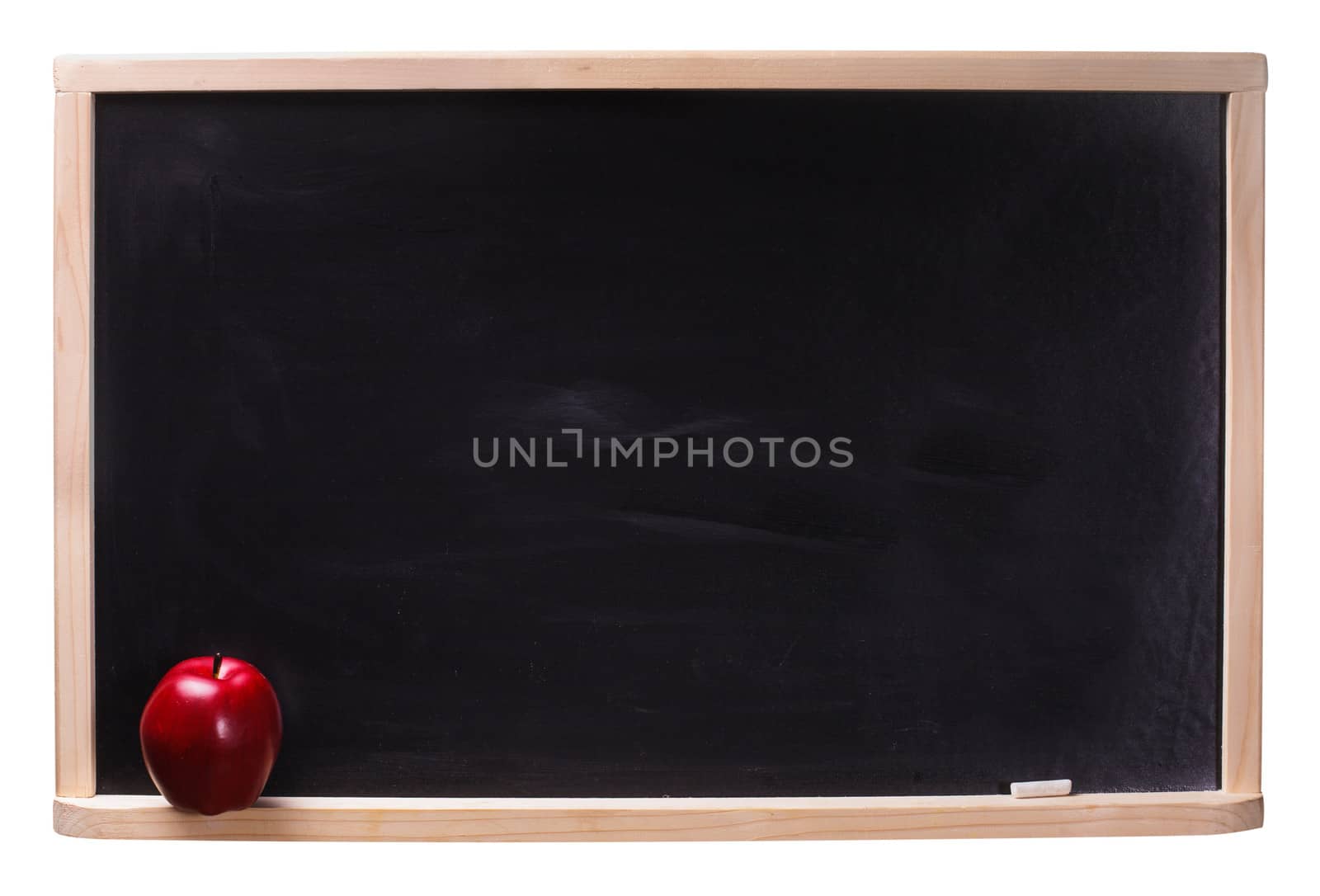 Black chalkboard with chalk piece  and red apple isolated on white