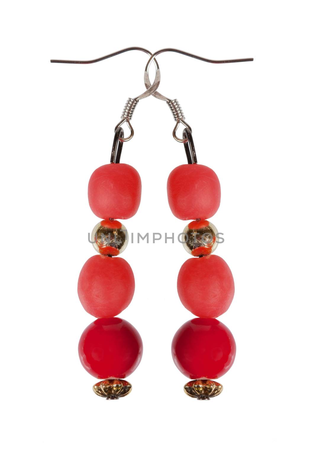 Earrings of red beads with gold elements isolated on a white background. Collage.