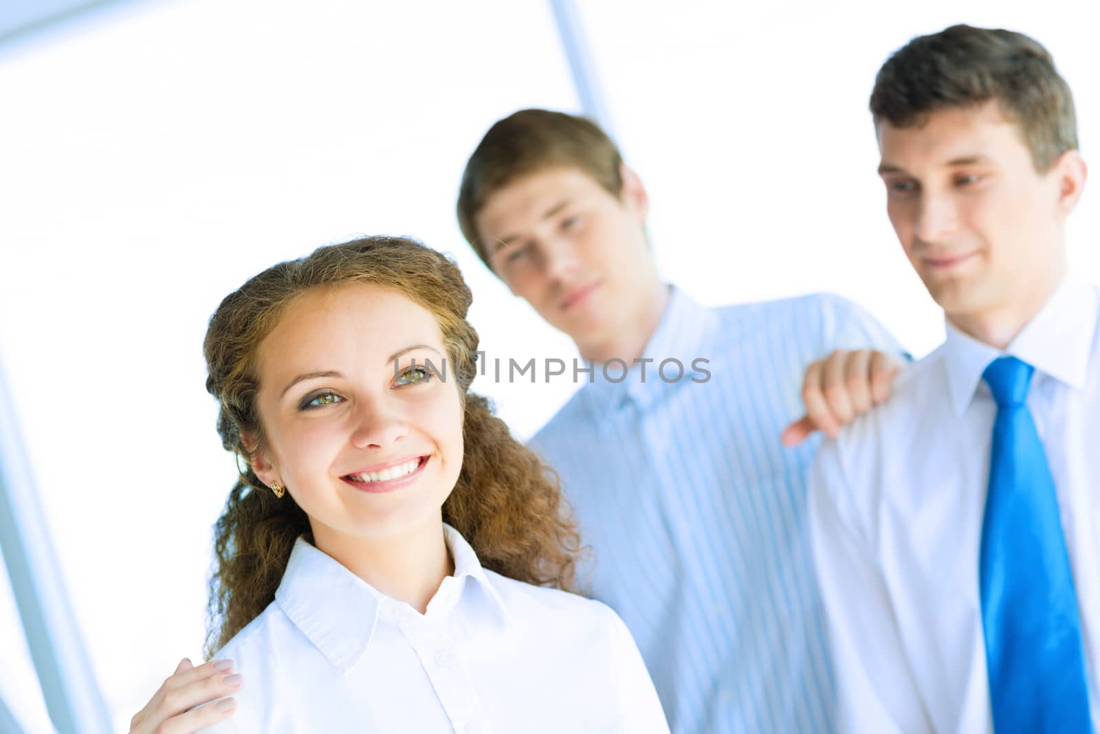 happy business woman standing next to their counterparts outside the flipchart achievements in business