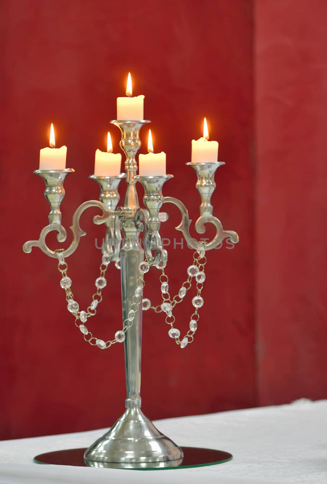 Formal silver candle holder with yellow candles