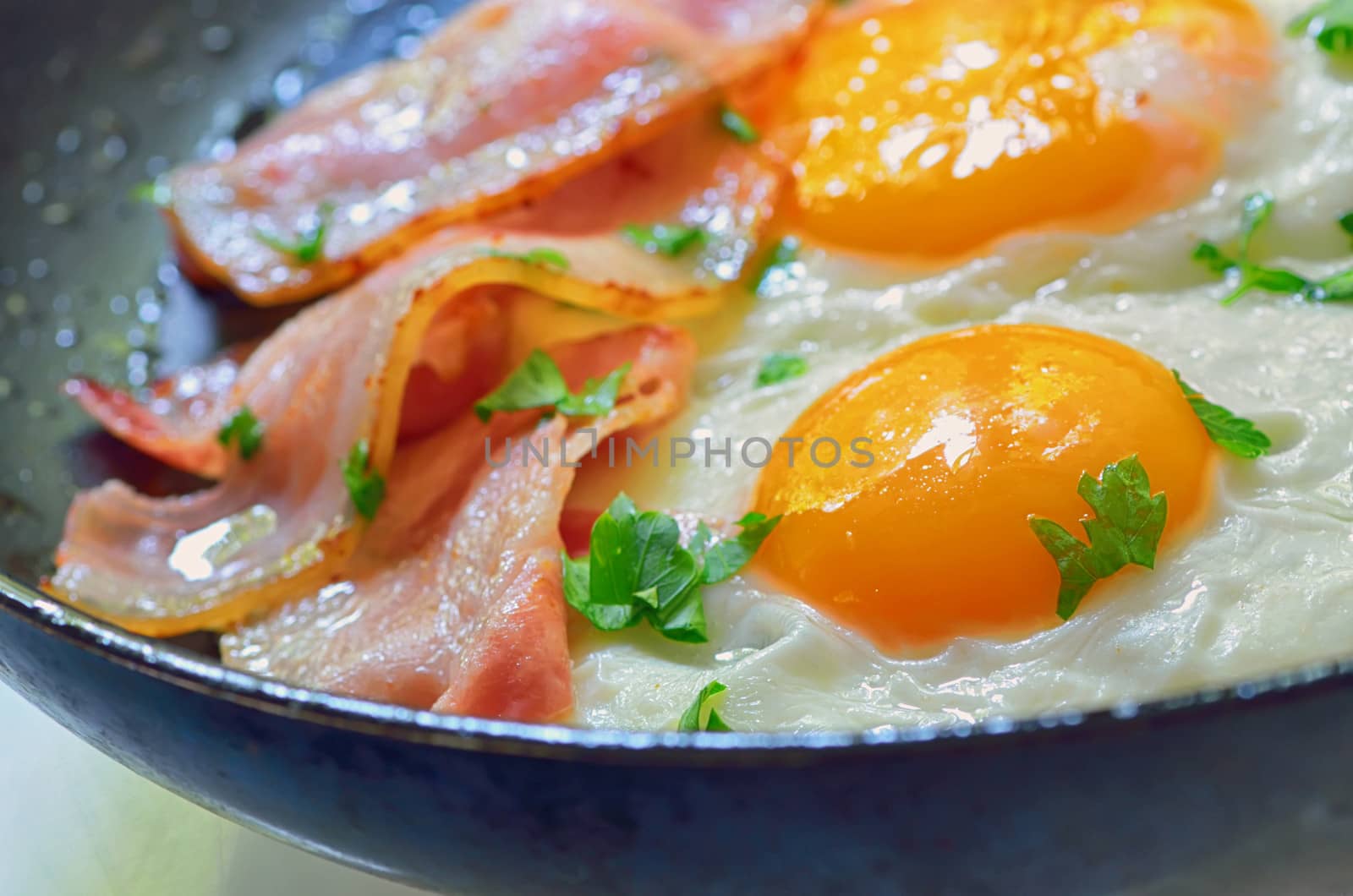 fried egg with bacon in a frying pan shoot in studio