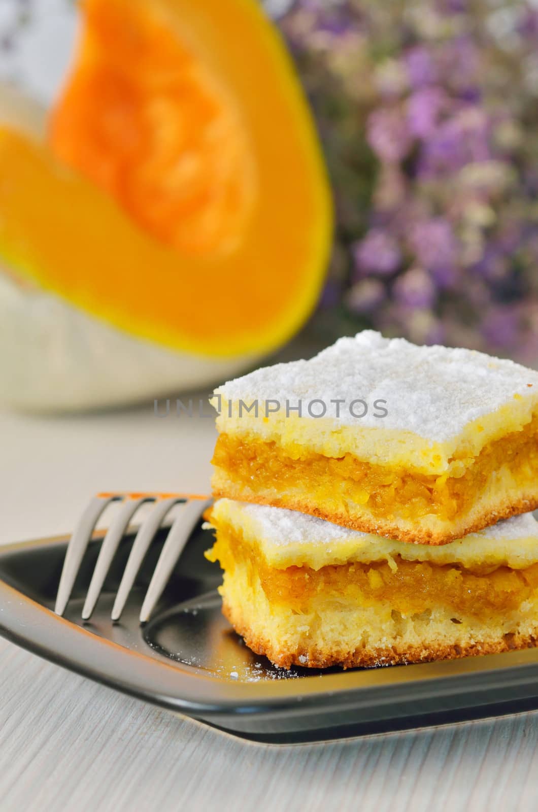 pumpkin pie on black dish