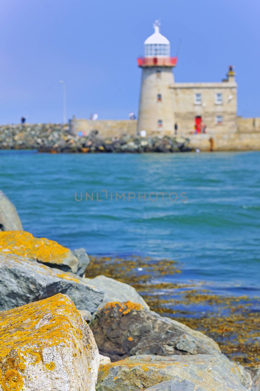 LIGHTHOUSE AT HOWTH HARBOR IN IRELAND