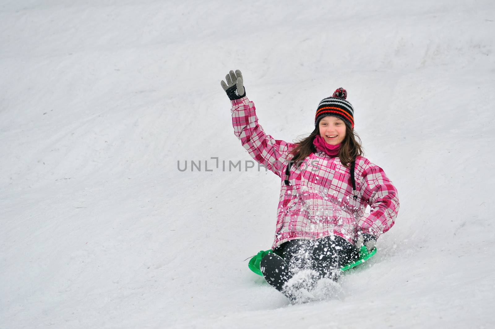 girl sliding in the snow by mady70