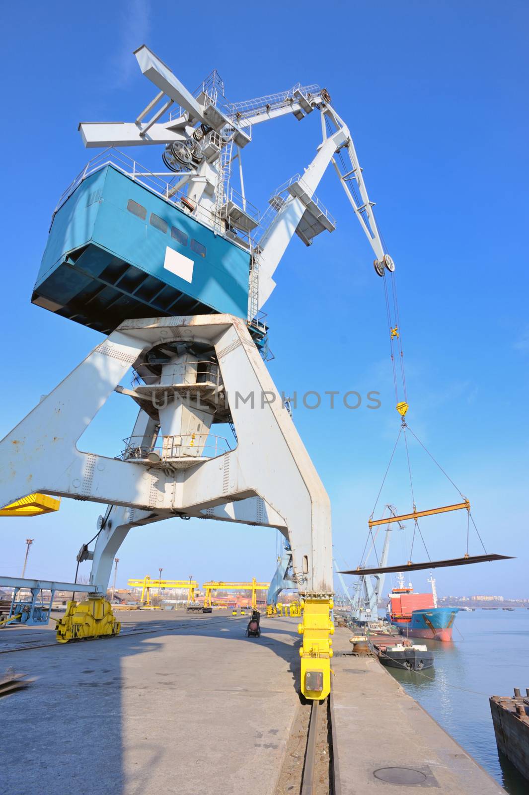 crane and steel plate loading  in harbor