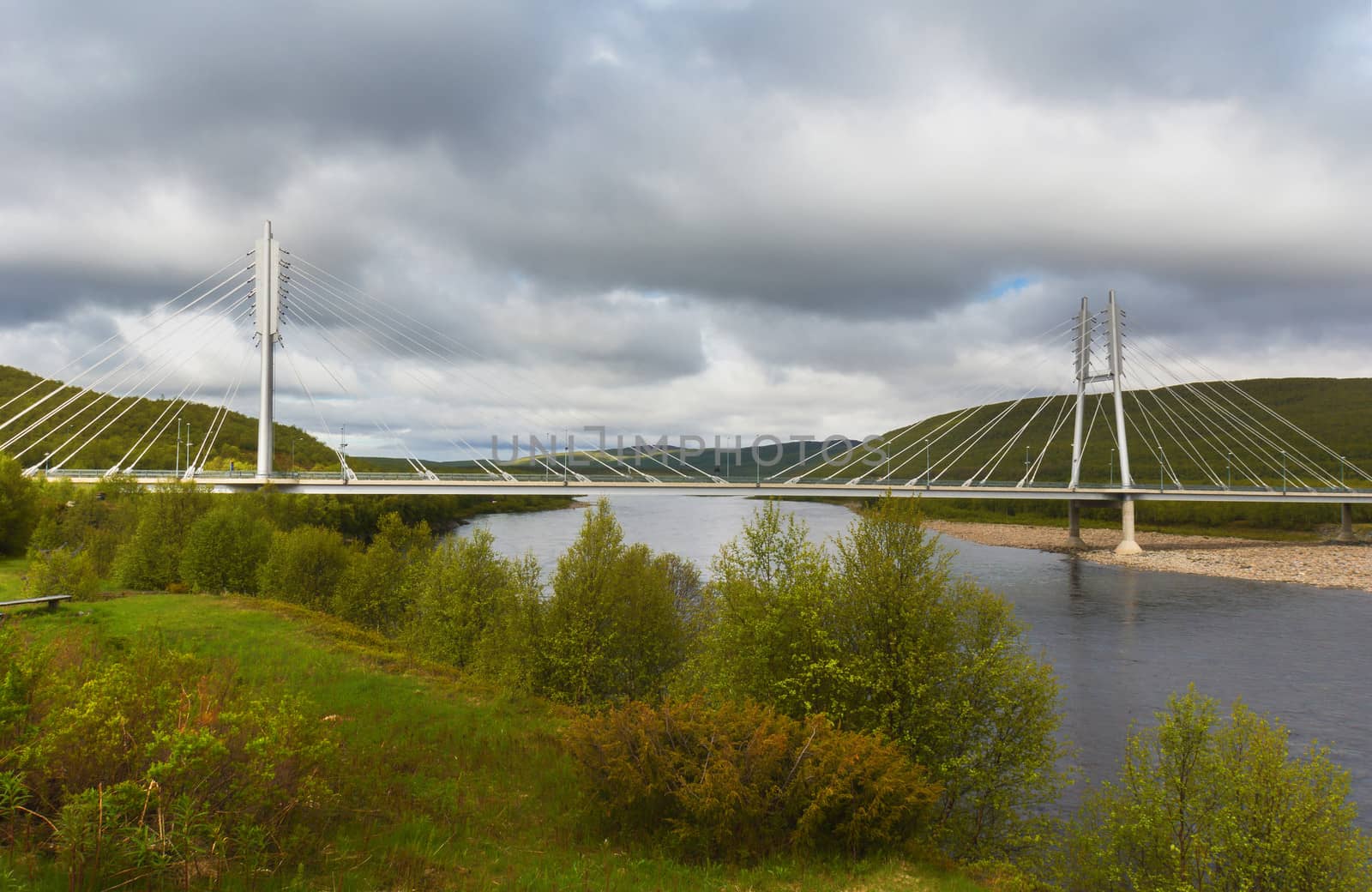 Utsjoki suspension bridge between Finland and Norway. by Claudine