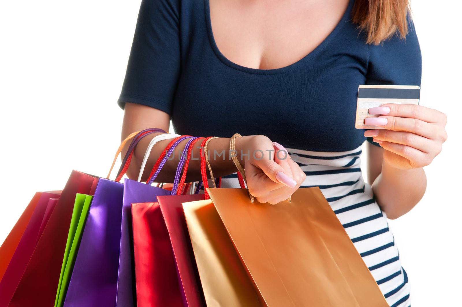 Woman Carrying Shopping Bags and holding a credit card isolated in a white background