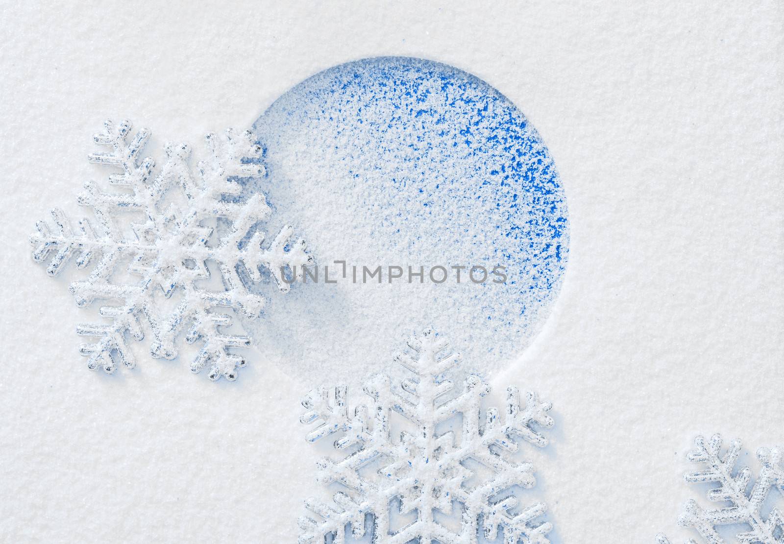 Snowflake on the snow. White xmas holiday background.