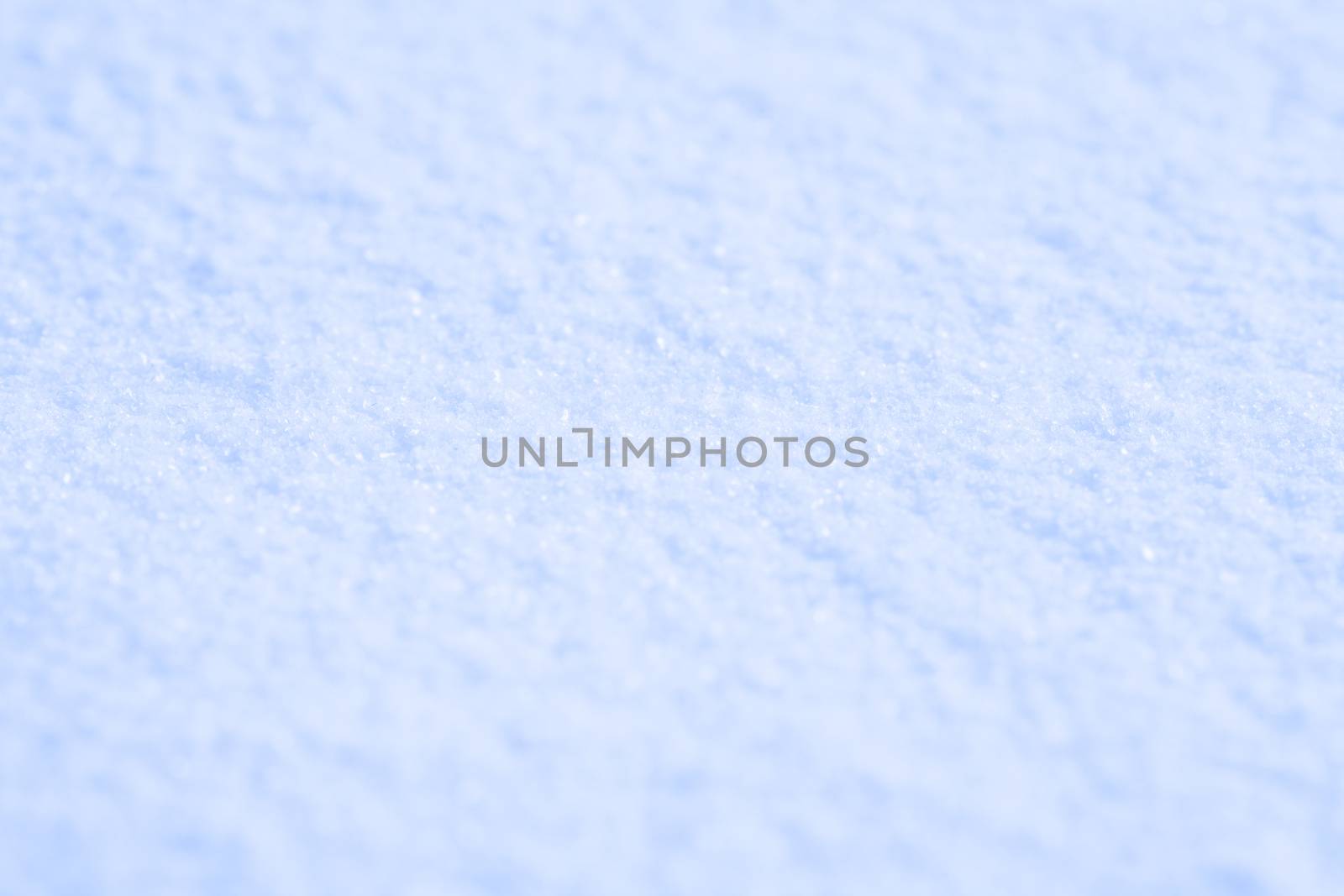 texture of white snow sparkling in the sun