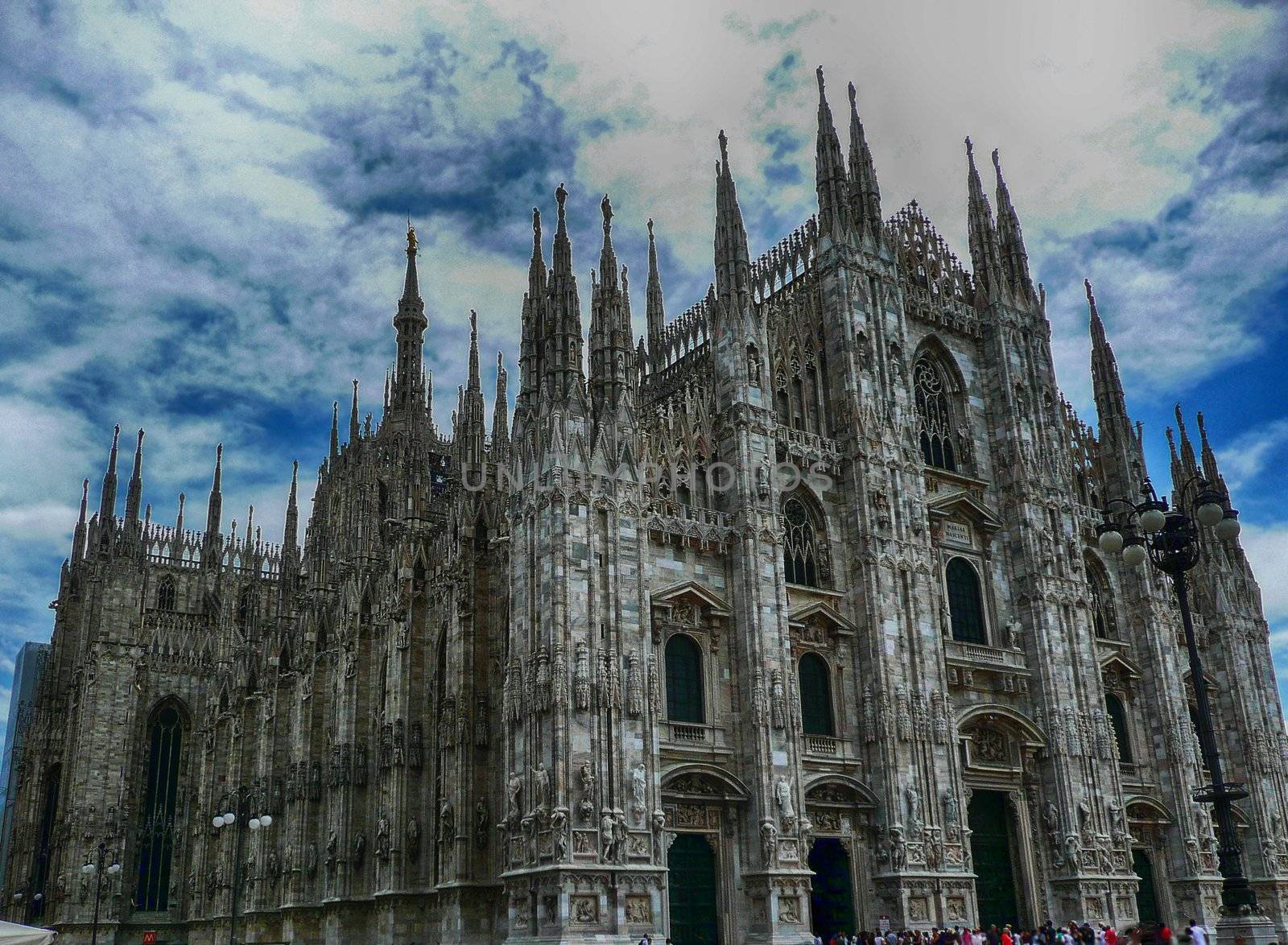 Milan Cathedral against a scenic cloudy sky, Italy