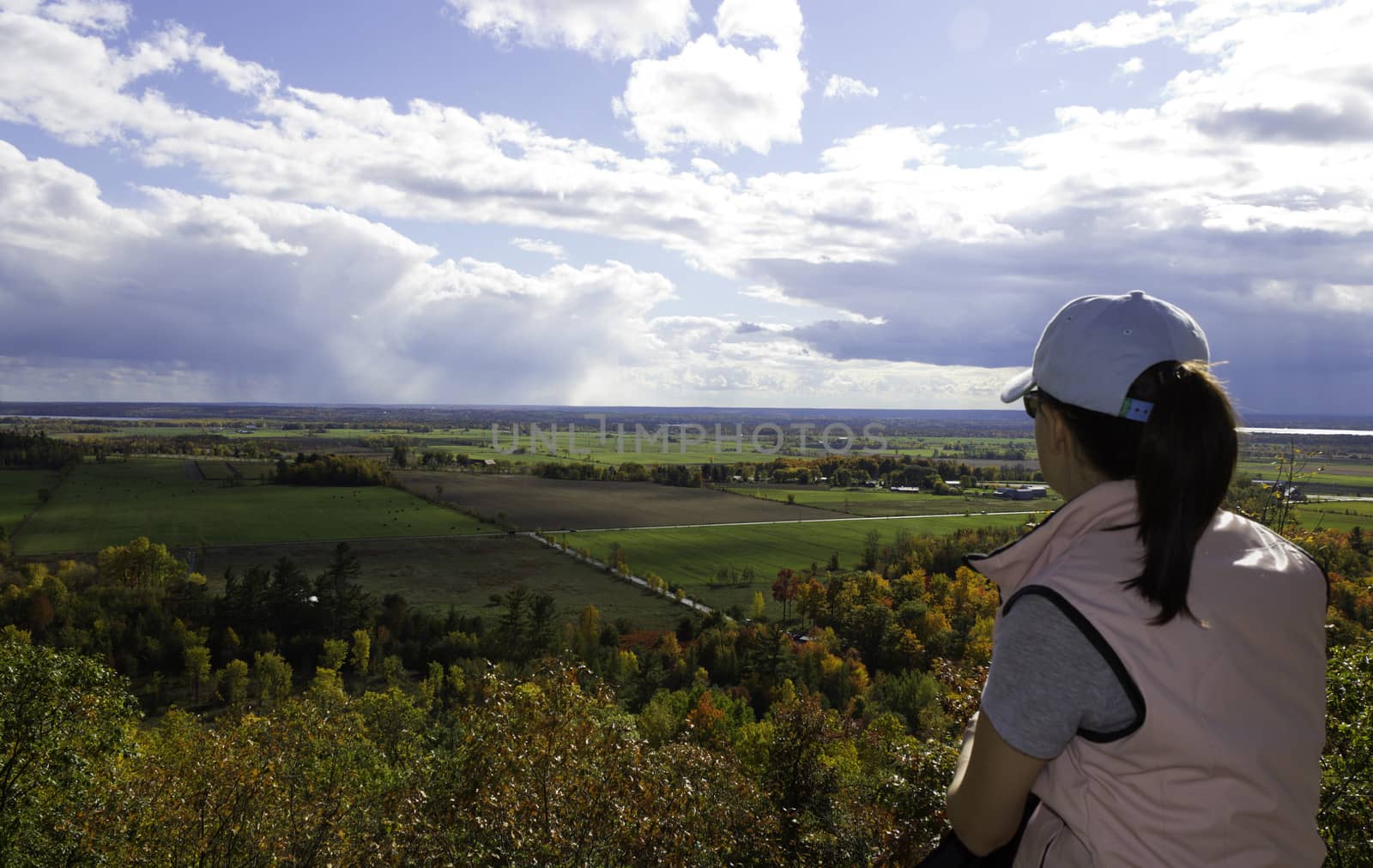 Young woman looks out on the rural scene