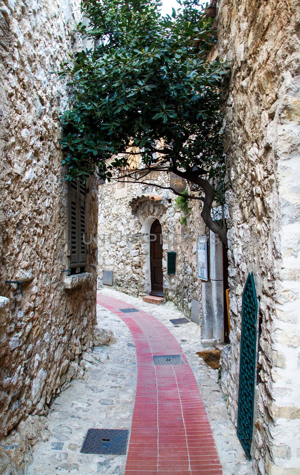 Curving Alley through stone walls in Eze