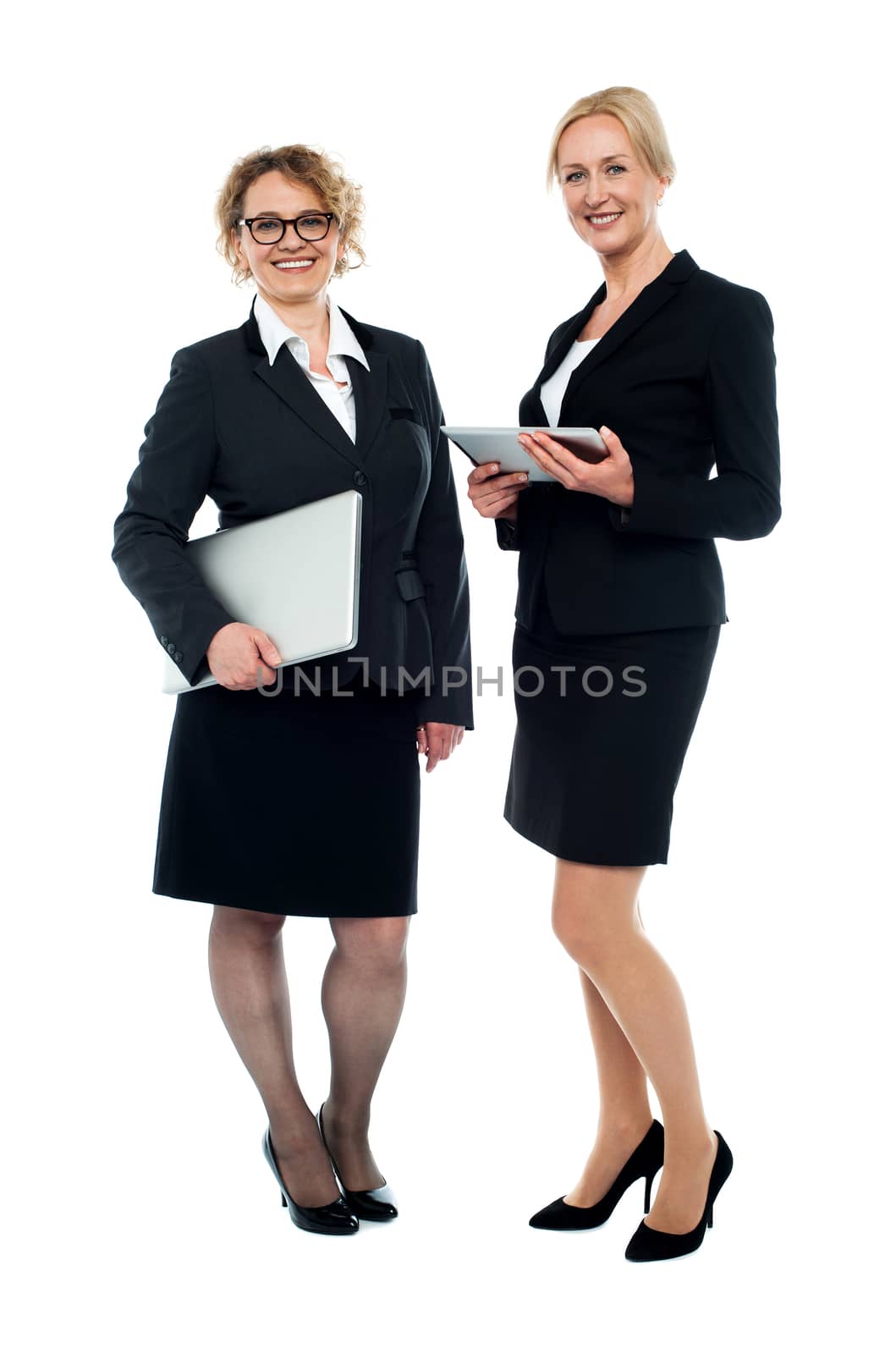 Full length studio shot of two businesswomen posing