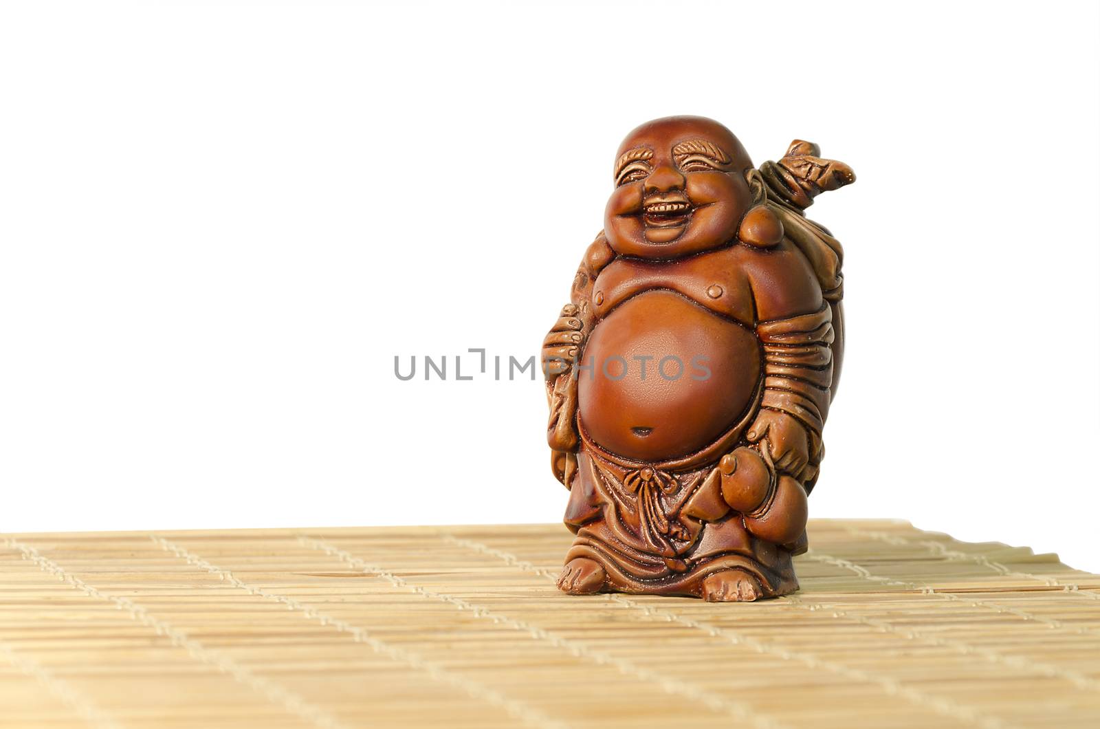 Statuette Hotei or the Laughing Buddha - the God of Wealth, joy and prosperity on a white background.