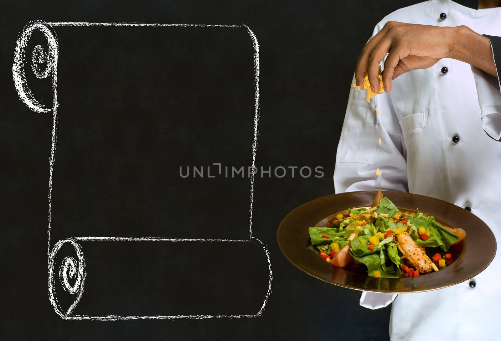 African America chef holding health salad dish with chalk scroll on blackboard Background