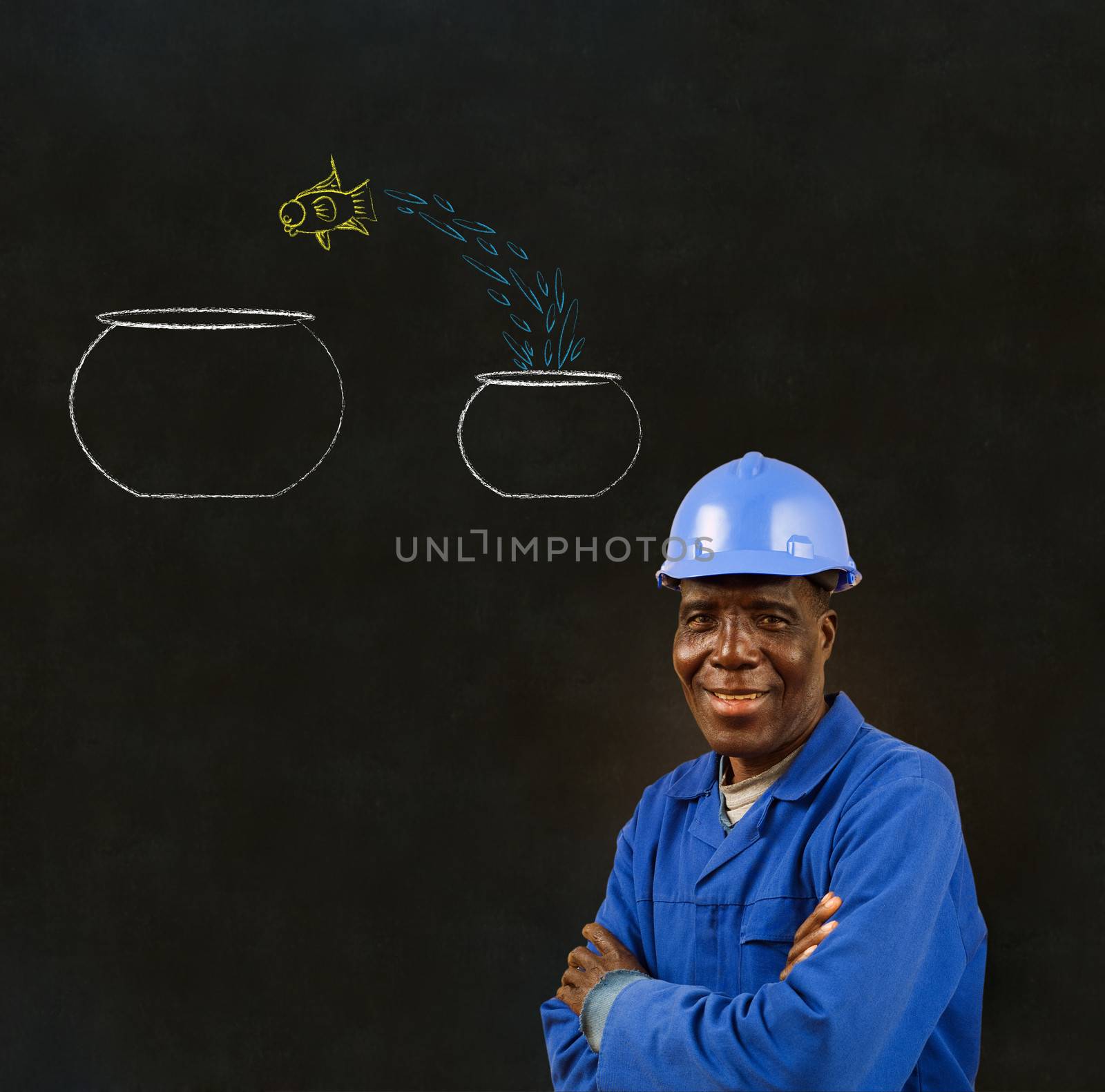 African American black man worker with chalk jumping fish bowls on a blackboard background