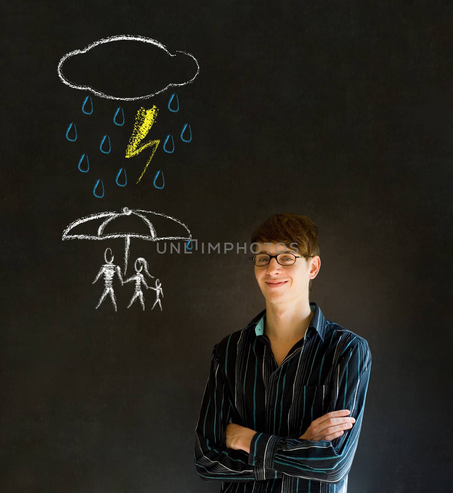 Man or Teacherthinking about protecting family from natural disaster on blackboard background by alistaircotton