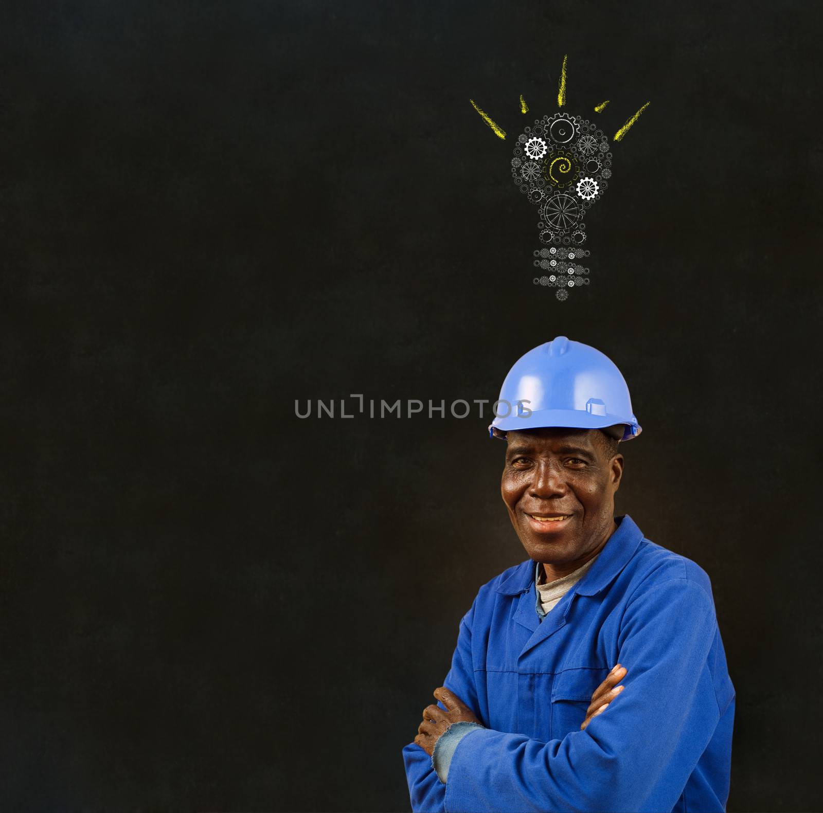 African American black man worker with a chalk gear cog lightbulb on a blackboard background by alistaircotton