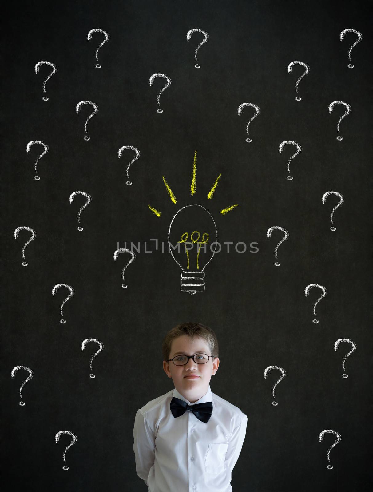 Thinking boy dressed up as business man questioning ideas by alistaircotton